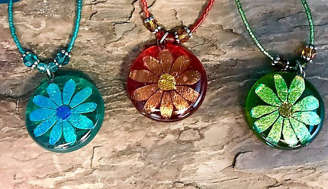 Liz Bowen’s dichroic glass and metal jewelry is featured in her new show opening Sept. 7, 2018, at the Art Shop Gallery, Homer, Alaska. (Photo provided)