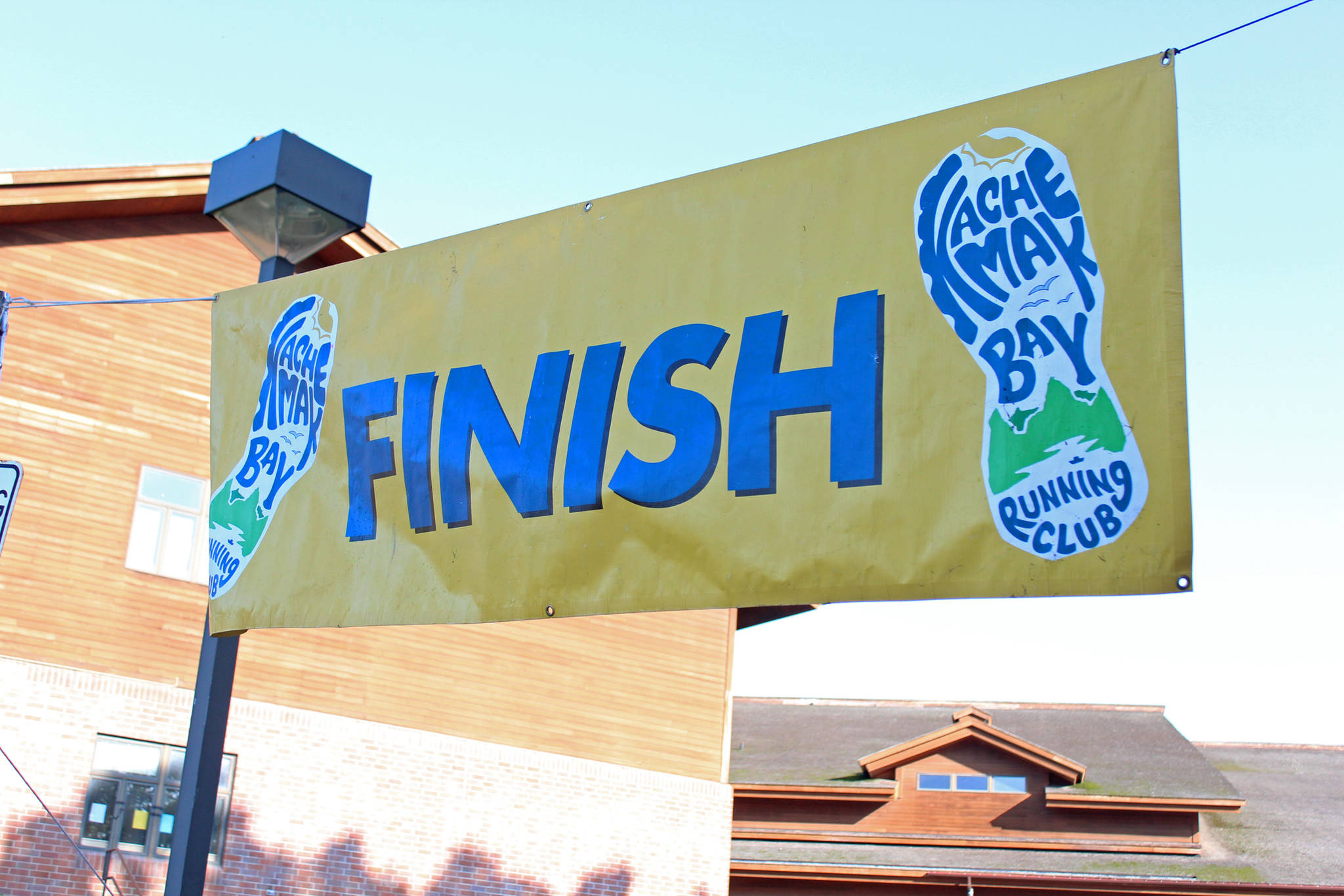 A finish line sign marks the end of the Homer Mariner Triathlon on Saturday, Sept. 1, 2018 at Homer High School in Homer, Alaska. The event drew 98 athletes. (Photo by Megan Pacer/Homer News)
