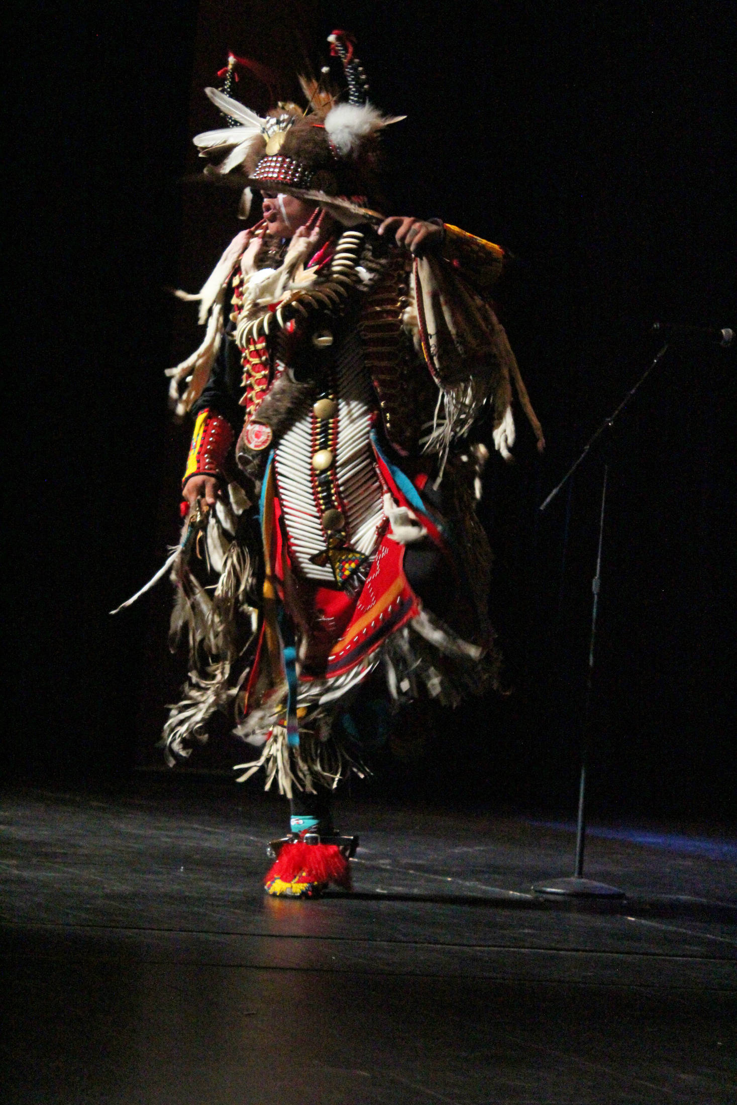 Joshua Atcheynum performs a dance called “Custer’s Last Stand” on Thursday, Sept. 6, 2018 at the Homer High School Mariner Theatre in Homer, Alaska. (Photo by Megan Pacer/Homer News)
