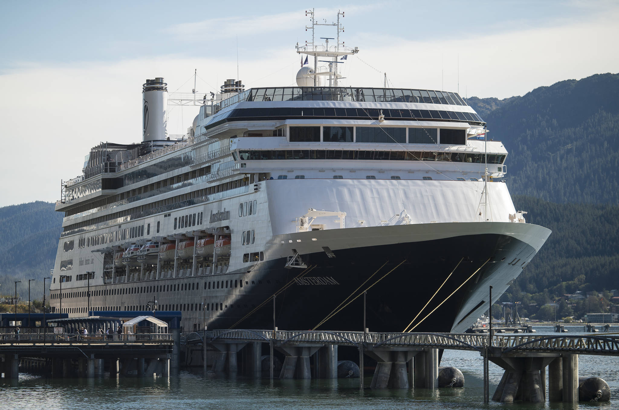 The Holland America Line ship Amsterdam sits at port in Juneau on Tuesday, Sept. 11, 2018. The Amsterdam is one of eight ships that have received Notice of Violations for air opacity issued by the Alaska Department of Environmental Conservation. (Michael Penn | Juneau Empire)