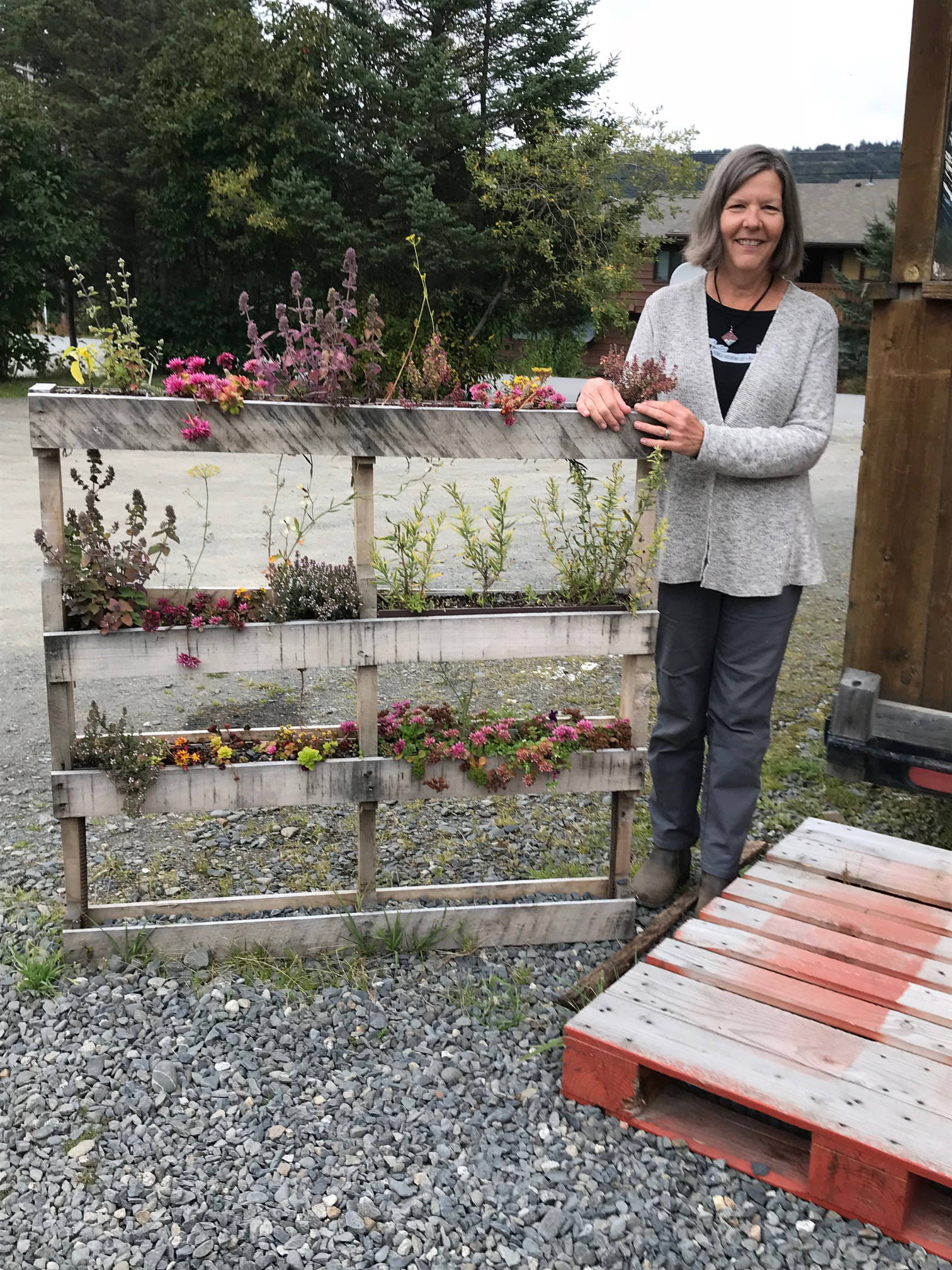 Karen Berger at Homer Brewing stands by her appealing application of pallets on Sept. 21, 2018, in Homer, Alaska. (Photo by Rosemary Fitzpatrick)