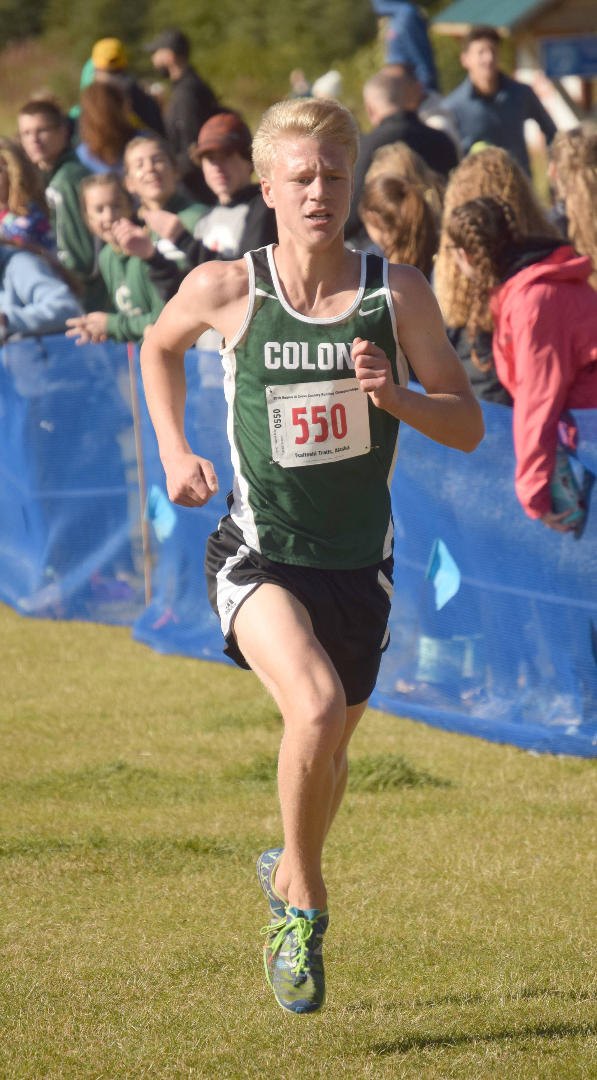 Colony sophomore Lane Meier runs to victory in the Division I boys race at the Region 3 meet Saturday, Sept. 22, 2018, at Tsalteshi Trails. (Photo by Jeff Helminiak/Peninsula Clarion)