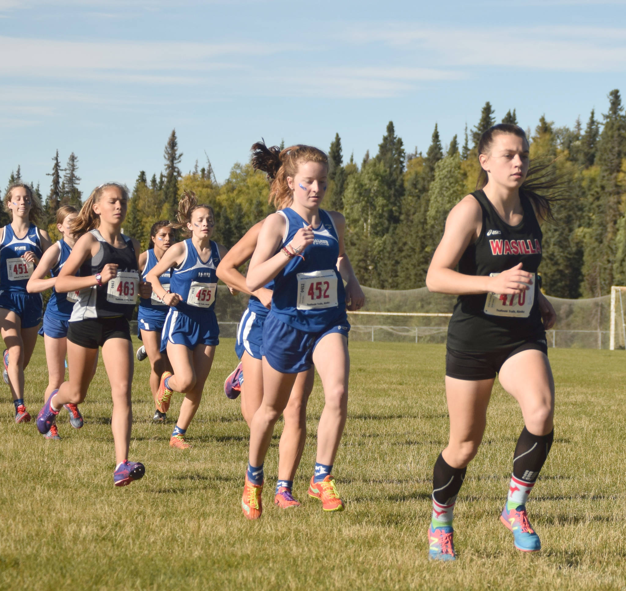 Soldotna’s Jordan Strausbaugh tucks in behind Wasilla’s Allison VanPelt and Palmer’s Katey Houser early in the Division I girls race at the Region 3 meet Saturday, Sept. 22, 2018, at Tsalteshi Trails. (Photo by Jeff Helminiak/Peninsula Clarion)