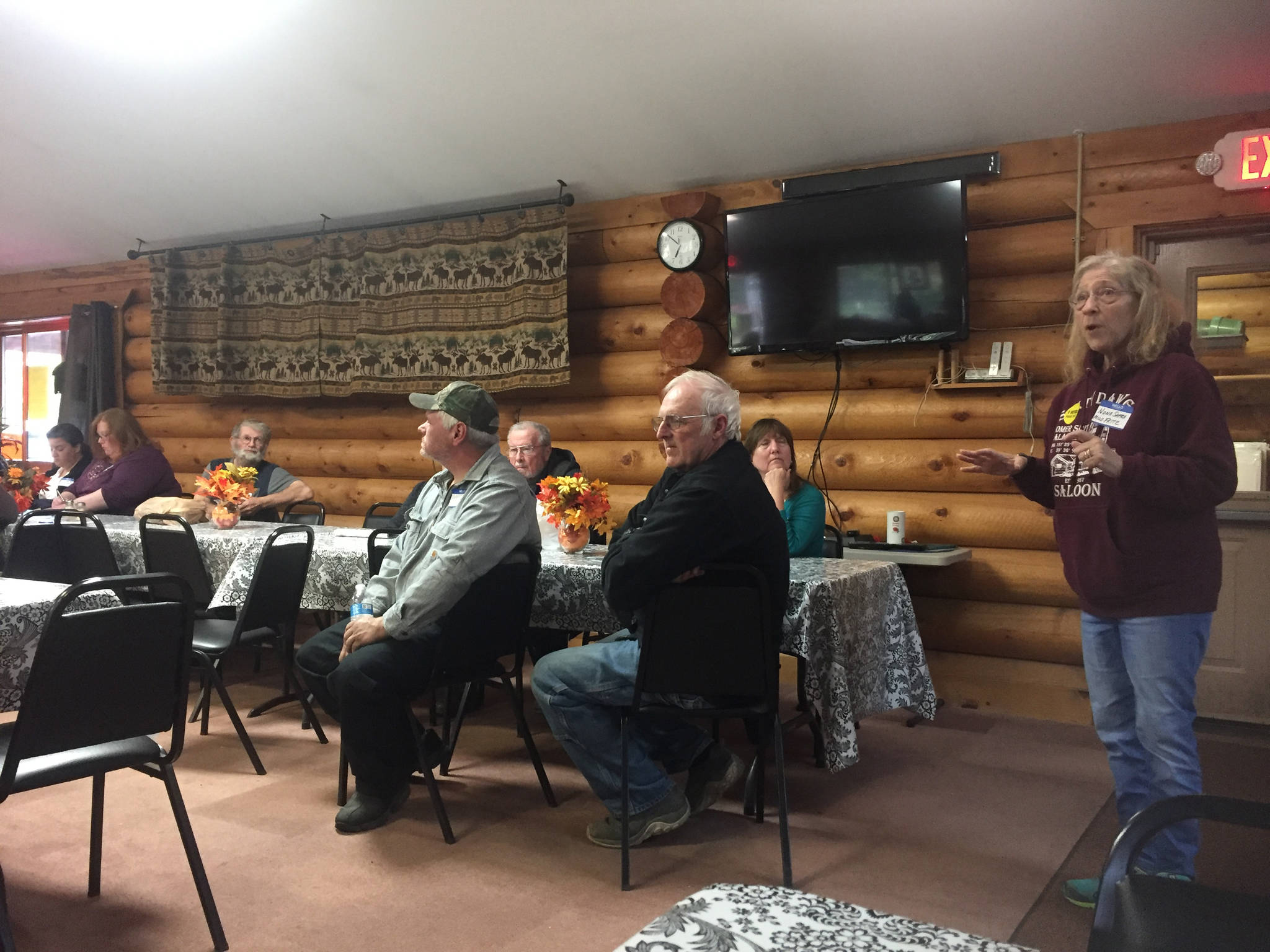Nona Safra welcomes community members to the third Anchor Point Neighborhood Watch meeting on Thursday, Sept. 20, 2018 the senior center in Anchor Point, Alaska. (Photo by Delcenia Cosman)