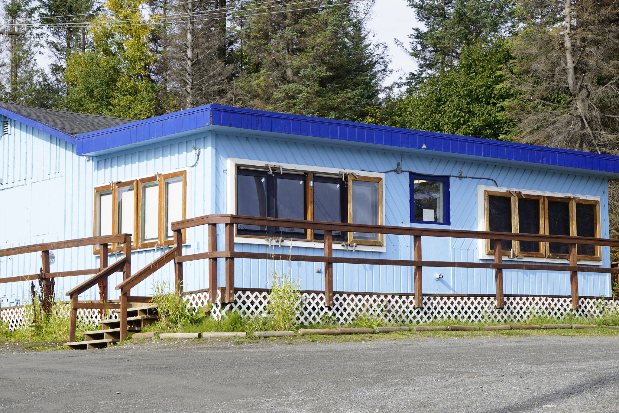 The distinctive blue building of Barb’s Video on Main Street is seen in this photo taken Sept. 22, 2018, in Homer, Alaska. (Photo by Michael Armstrong/Homer News)
