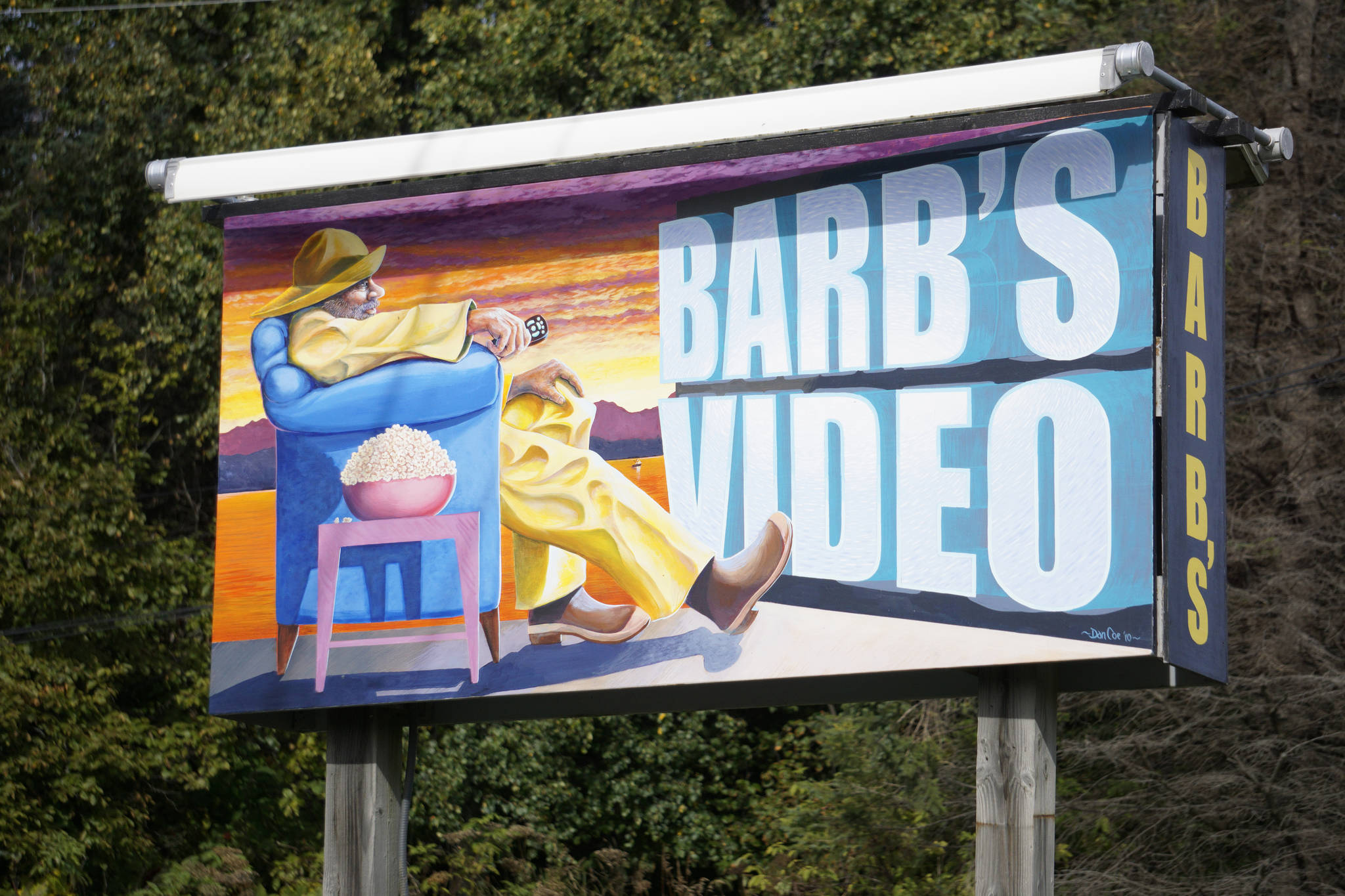 The latest version of the Barb’s Video sign was painted by Dan Coe, as seen in this photo taken Sept. 22, 2018, in Homer, Alaska. (Photo by Michael Armstrong/Homer News)