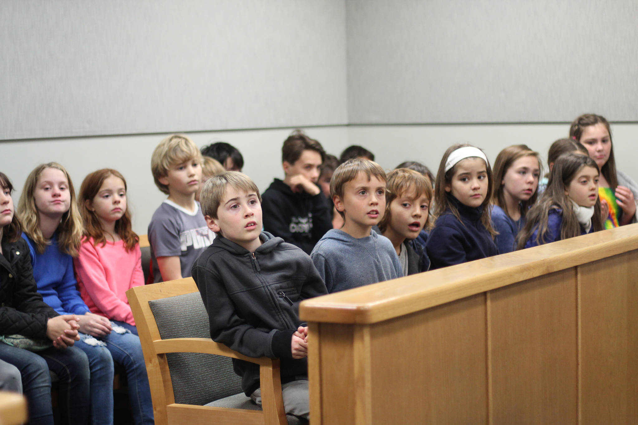 Students from Fireweed Academy listen to a presentation during an Oct. 8, 2018 field trip to the Homer Courthouse in Homer, Alaska. There, the learned more about the law, law enforcement and the inner workings of the court. (Photo by Megan Pacer/Homer News)