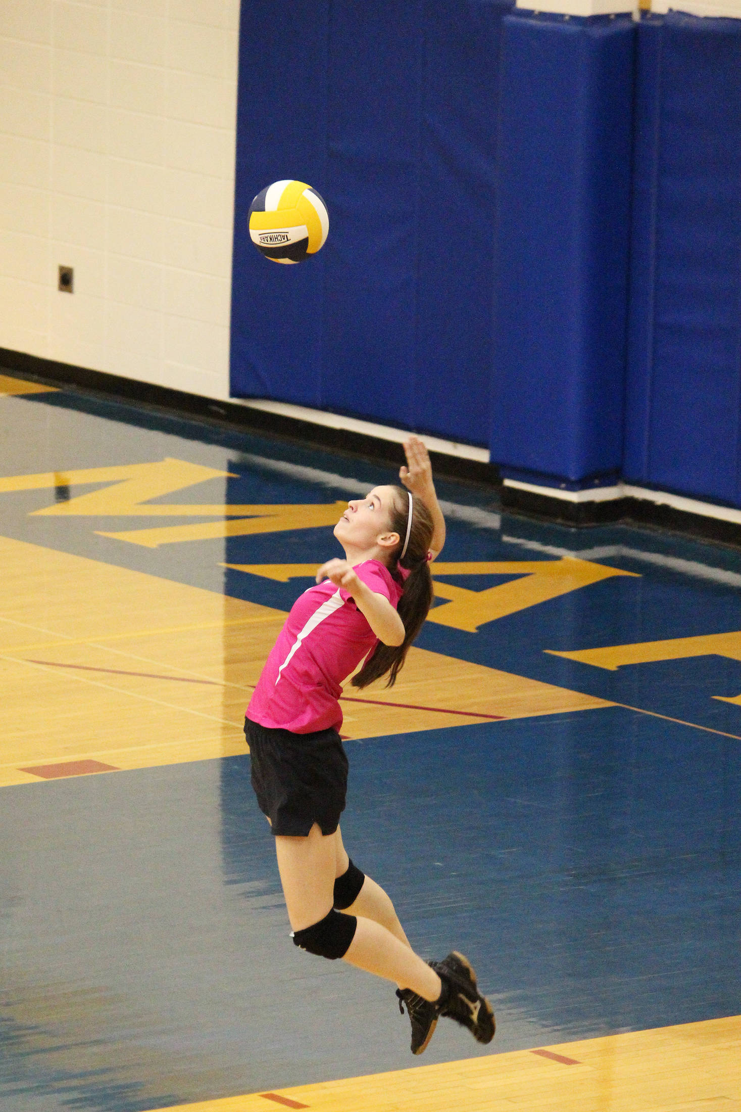 Homer’s Laura Inama jumps to serve the ball to the Soldotna High School volleyball team during their game Tuesday, Oct. 9, 2018 at Homer High School in Homer, Alaska. (Photo by Megan Pacer/Homer News)