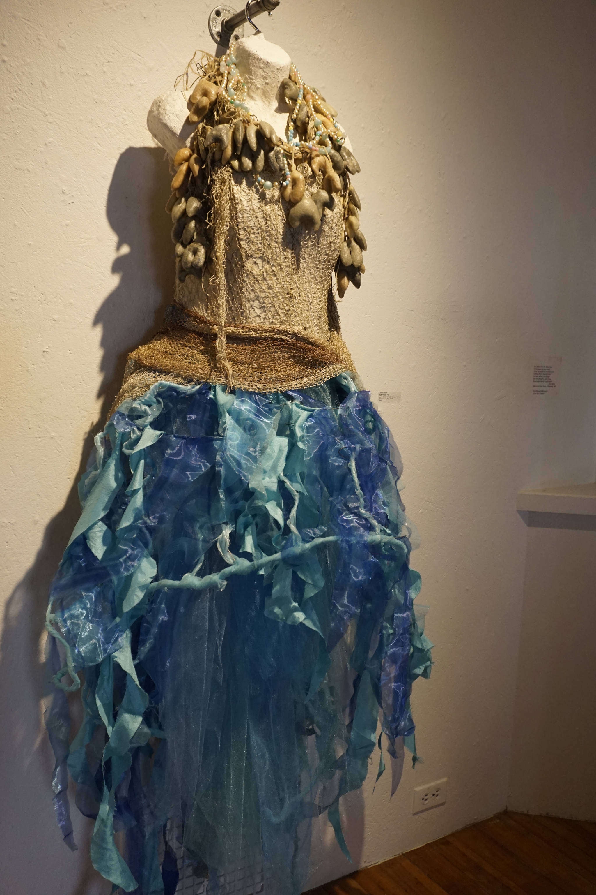 Keren Lowell’s “Full Fathom Five,” part of her show at Bunnell Street Arts Center as seen at the First Friday, Oct. 6, 2018, opening in Homer, Alaska. The title refers to a line in Willam Shakespear’es “The Tempest”: “Full fathom five thy father lies.” Many of Lowell’s garments have poetic references. (Photo by Michael Armstrong/Homer News)