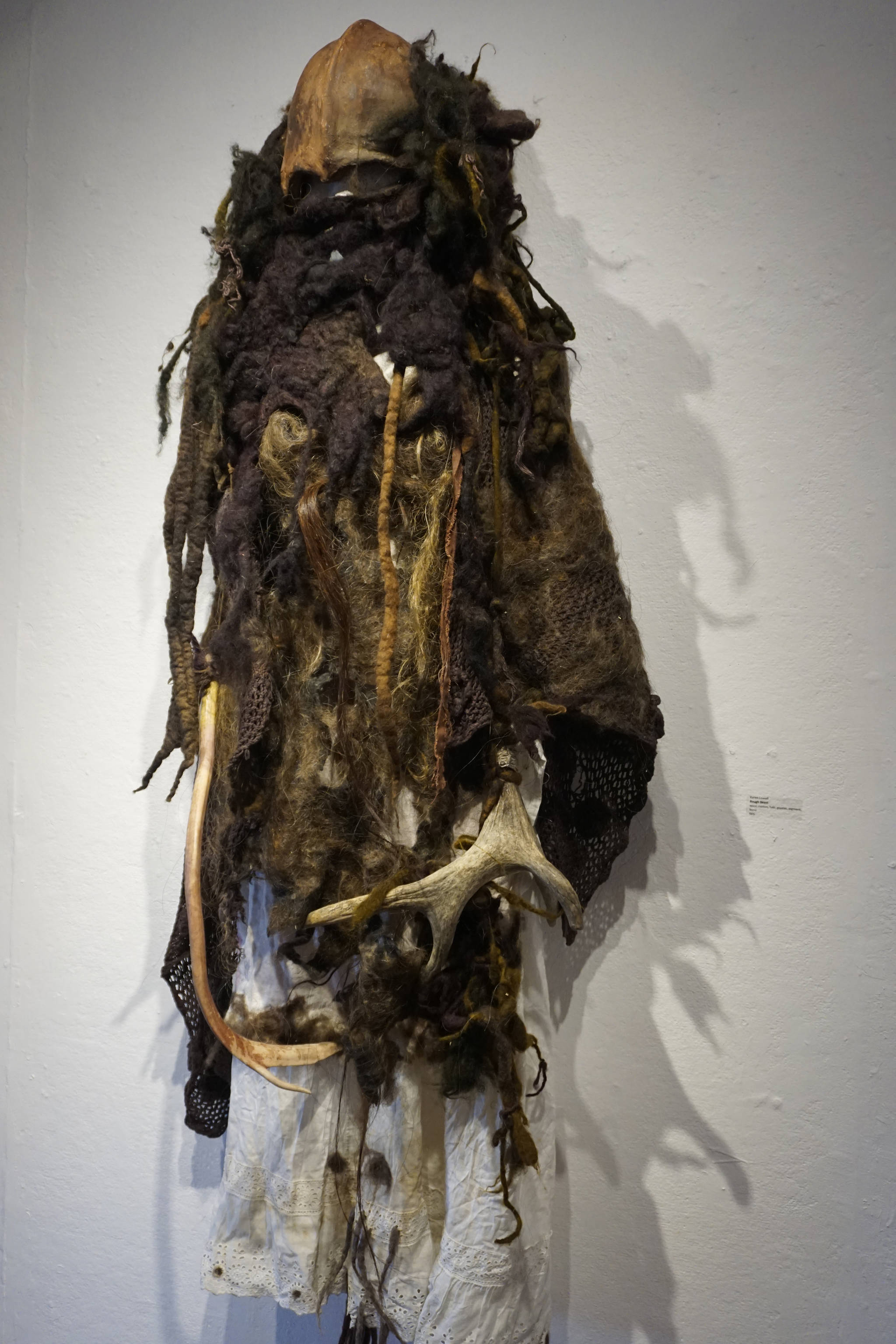 Keren Lowell’s “Rough Beast,” part of her show at Bunnell Street Arts Center as seen at the First Friday, Oct. 6, 2018, opening in Homer, Alaska. The title refers to a line in Willam Butler Yeats’ poem “Second Coming”: “And what rough beast, its hour come round at last / slouches its way to Bethlehem to be born?” Many of Lowell’s garments have poetic references. (Photo by Michael Armstrong/Homer News)