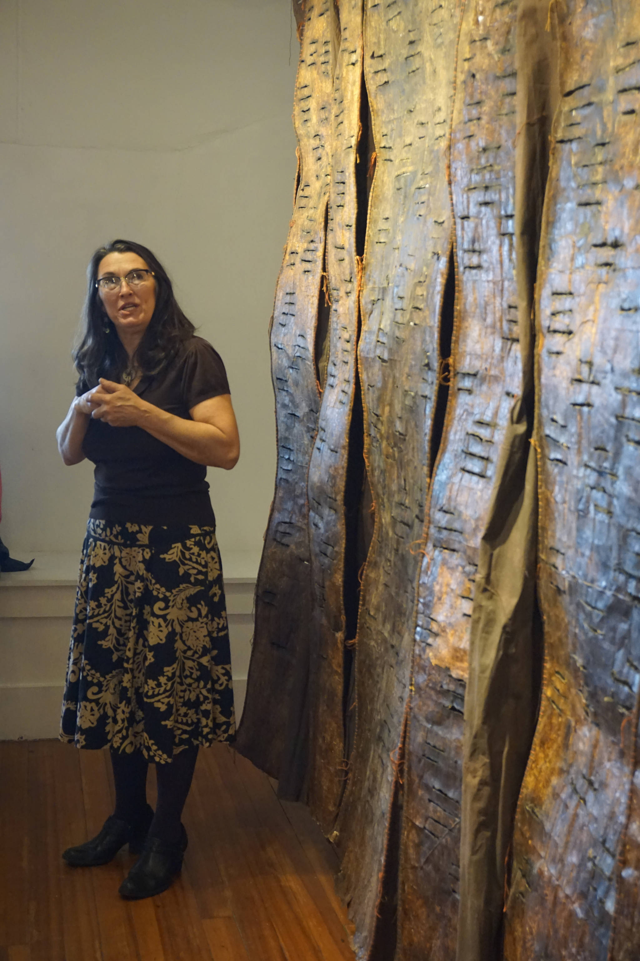 Keren Lowell speaks about her show at Bunnell Street Arts Center for its First Friday, Oct. 6, 2018, opening in Homer, Alaska. (Photo by Michael Armstrong/Homer News)