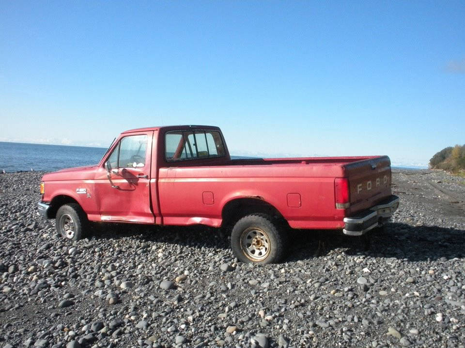 A Ford F-150 pickup truck sits abandoned on the beach about 2 miles south of Diamond Creek in this photo taken in October 2011 near Homer, Alaska The plates and vehicle identification number had been removed. (File photo by Michael Armstrong/Homer News)