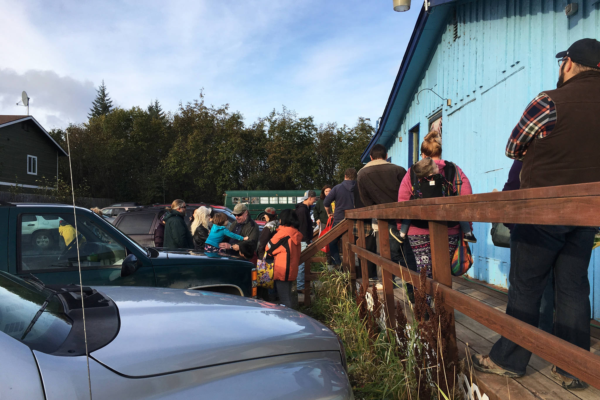 People queue up waiting for Barb’s Video and DVD to open on Saturday, Oct. 20, 2018 in Homer, Alaska. Movie lovers got there early to get their hands on their favorite films on the first day of the movie rental store’s merchandise sale. (Photo by Megan Pacer/Homer News)