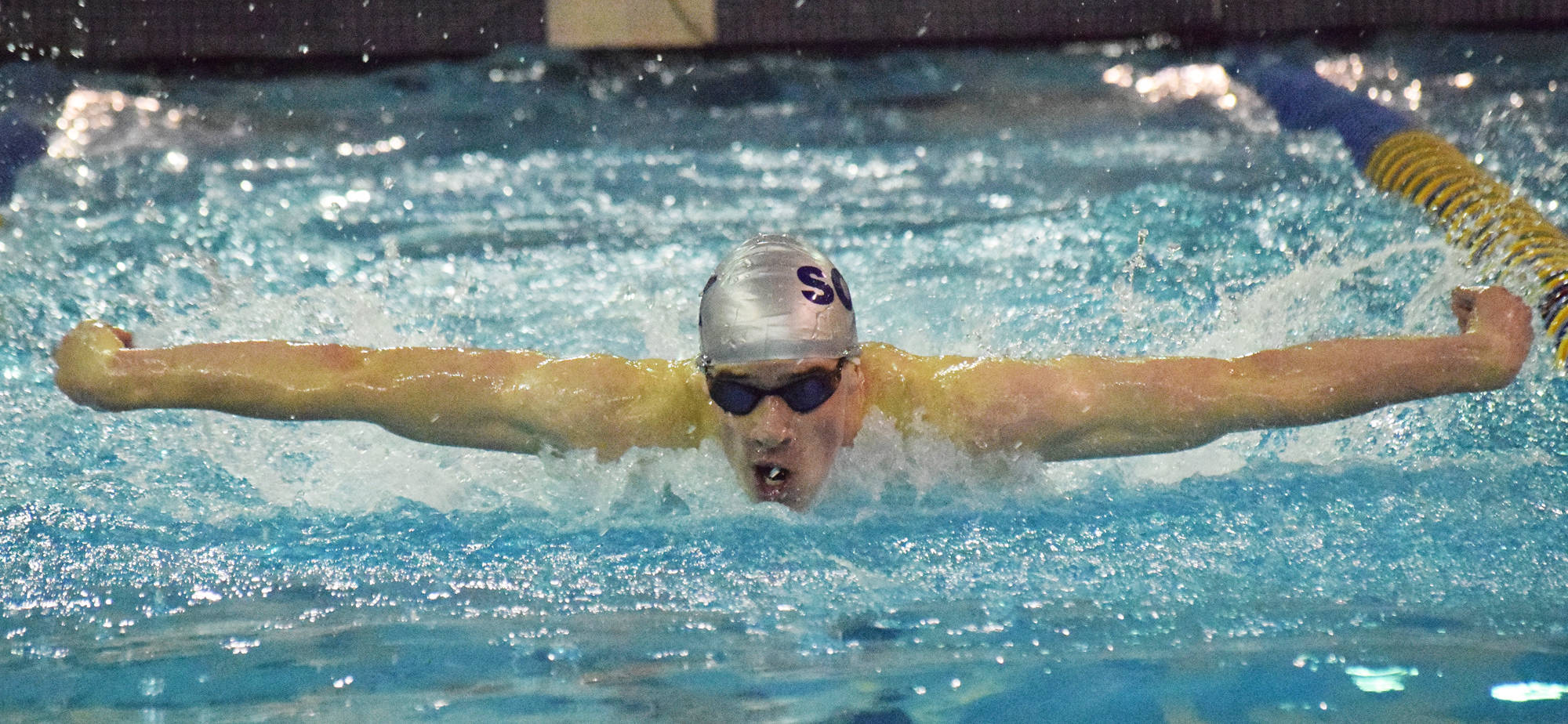 Soldotna’s Ethan Evans competes in the boys 100-yard butterfly final Saturday, Oct. 27, 2018 at the Northern Lights Conference championship swim meet at Homer High School in Homer, Alaska. (Photo by Joey Klecka/Peninsula Clarion)