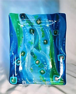 Nancy Wise’s fused glass plate, on display at the Art Shop Gallery in Homer, Alaska. (Photo provided)
