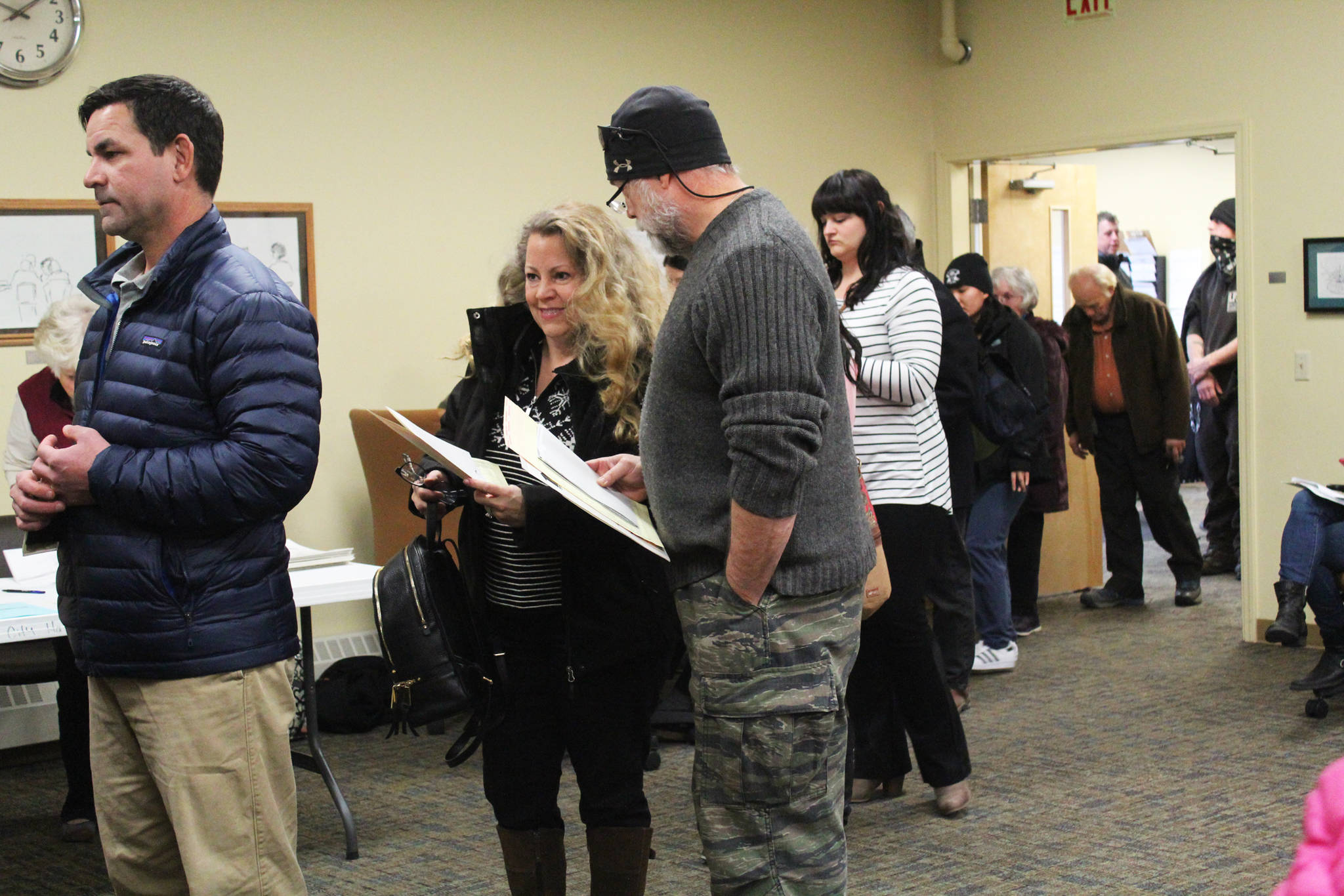 Homer residents wait in line to cast their votes in the 2018 midterm election Tuesday, Nov. 6, 2018 at Homer City Hall in Homer, Alaska. (Photo by Megan Pacer/Homer News)