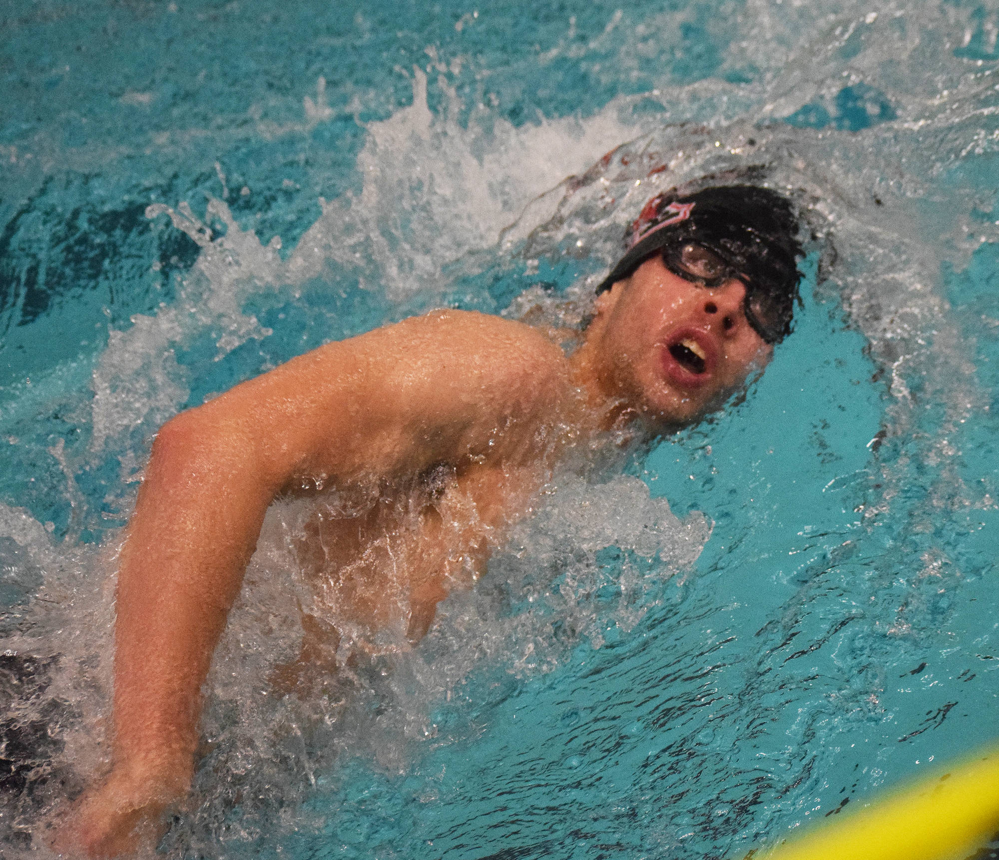 Kenai swimmer Trevor Bagley races in the boys 400-yard freestyle relay Saturday, Nov. 3, 2018 at the ASAA swimming and diving state championships at Bartlett High School in Anchorage, Alaska. (Photo by Joey Klecka/Peninsula Clarion)