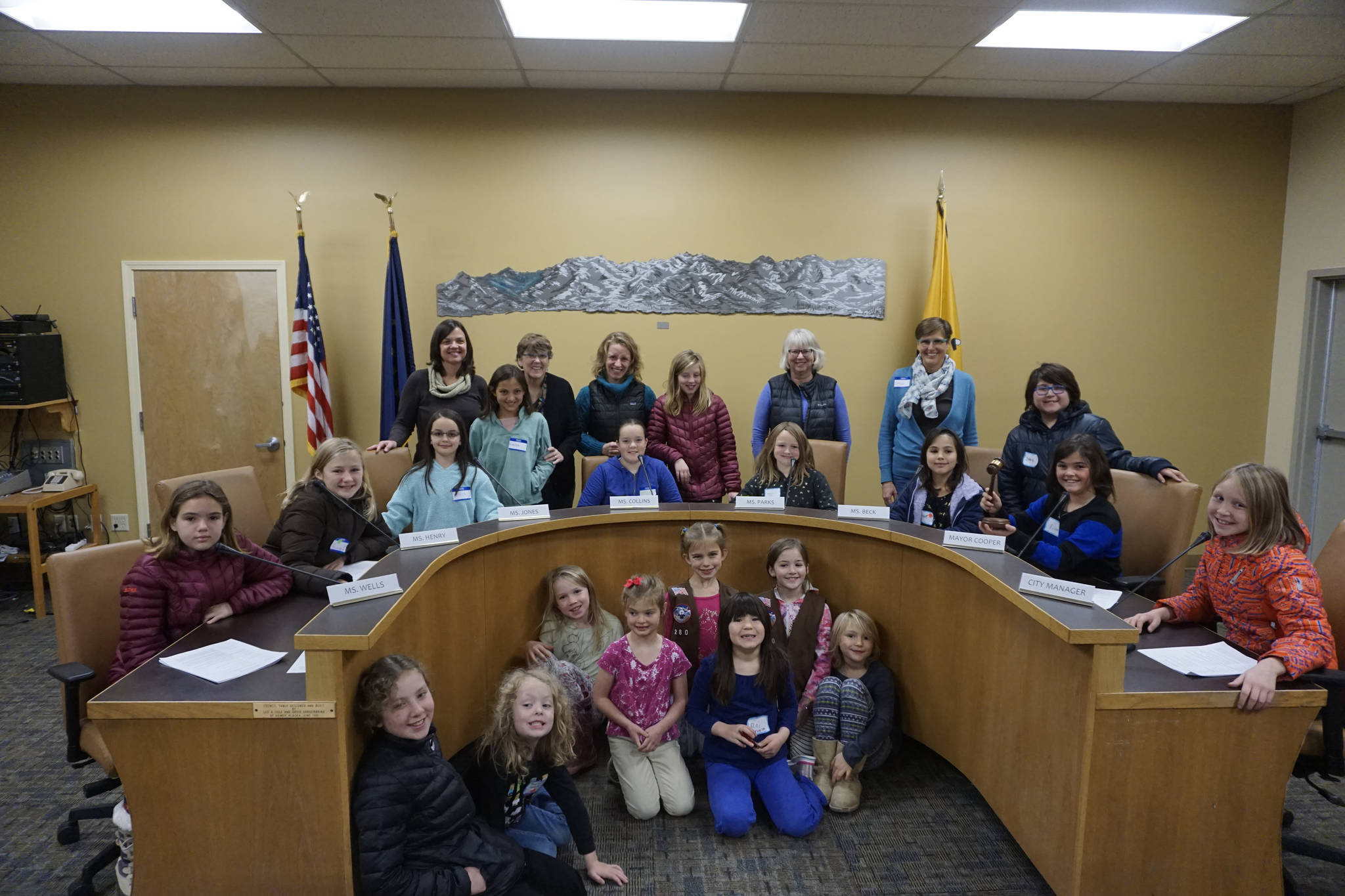 Members of Girl Scout Troops 280, 226, 134, 258 and 33, front, pose last Friday, Nov. 2, 2018, after a mock Homer City Council meeting in the Cowles Council Chambers at Homer City Hall, in Homer, Alaska. (Photo by Michael Armstrong/Homer News)