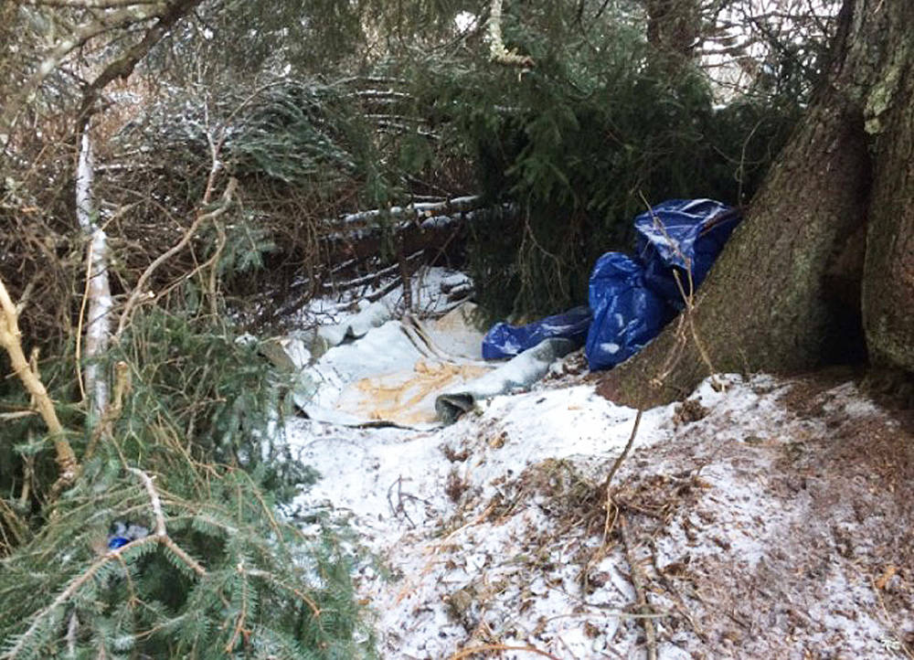 Port Graham resident Ryan Meganack’s makeshift camp, about 400 feet from his mother’s home in the village across Kachemak Bay from Homer, where he was found and arrested in Dec. 2016. (Photo courtesy U.S. Attorney’s Office, District of Alaska)