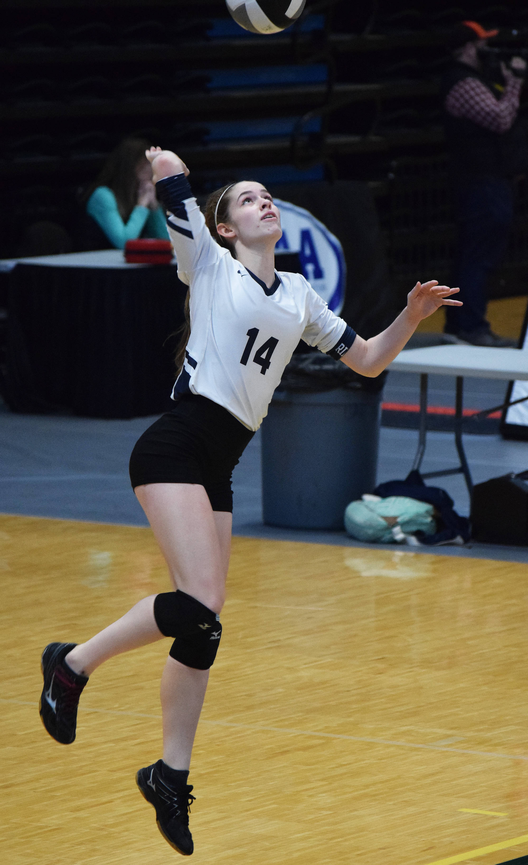 Homer’s Laura Inama unleashes a serve against Barrow at the Class 3A state volleyball tournament Friday, Nov. 9, 2018 at the Alaska Airlines Center in Anchorage, Alaska. (Photo by Joey Klecka/Peninsula Clarion)