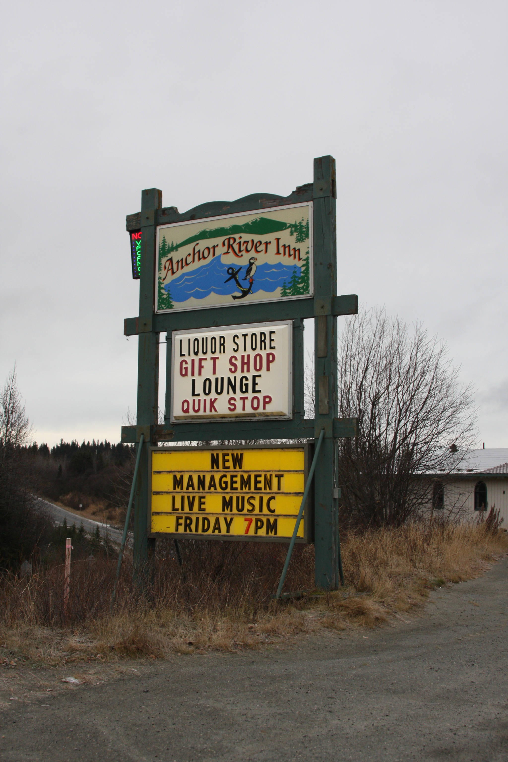 The Anchor River Inn sign overlooks the Sterling Highway on Nov. 10, 2018, in Anchor Point, Alaska, announcing that the business is under new management. (Photo by Delcenia Cosman)