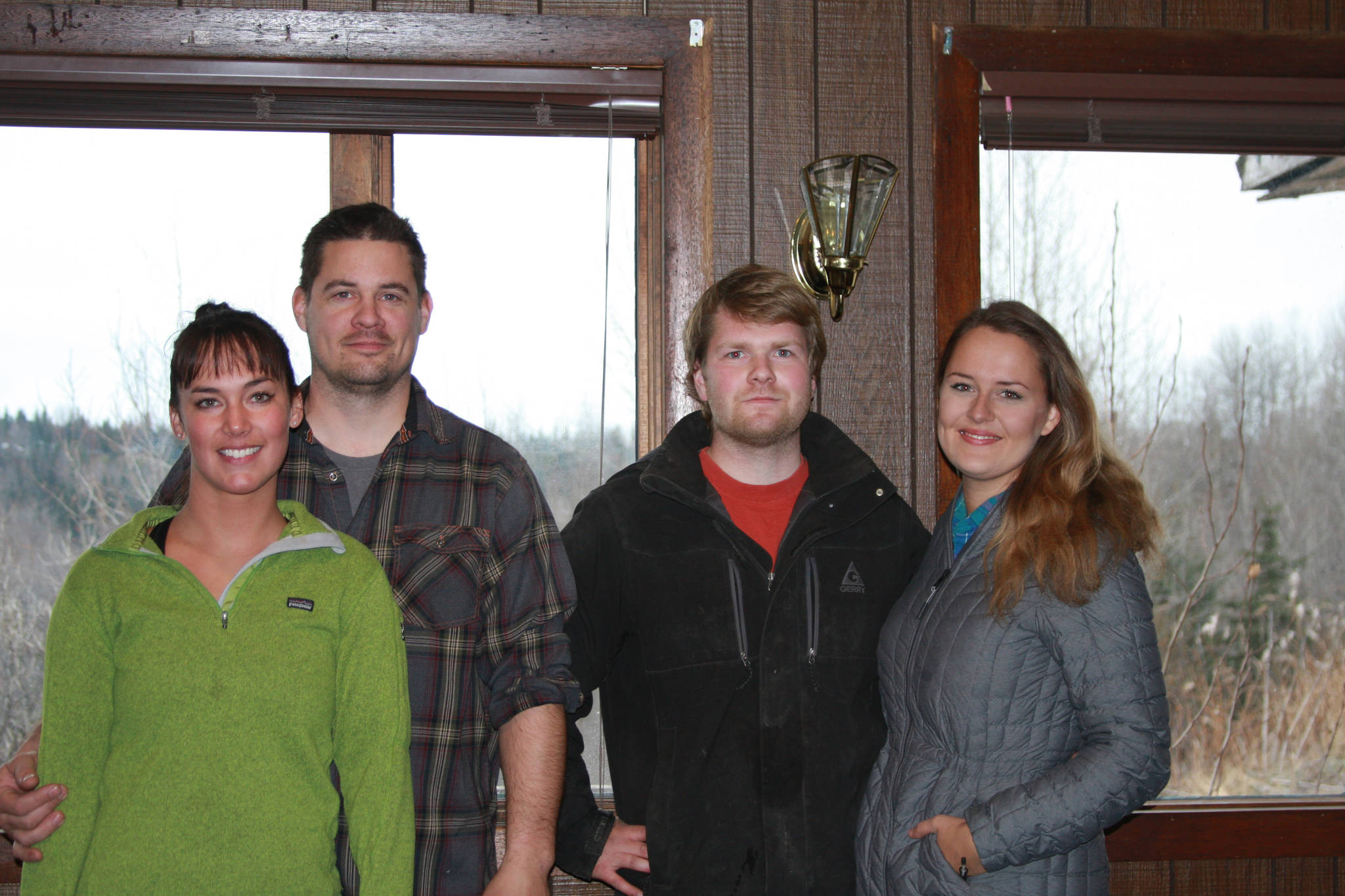 From left to right, new managers and upcoming owners Brittnay and Kyle Akee and Billy and Mamie Walker pose in the restaurant of the Anchor River Inn on Nov. 10, 2018 in Anchor Point, Alaska. (Photo by Delcenia Cosman)