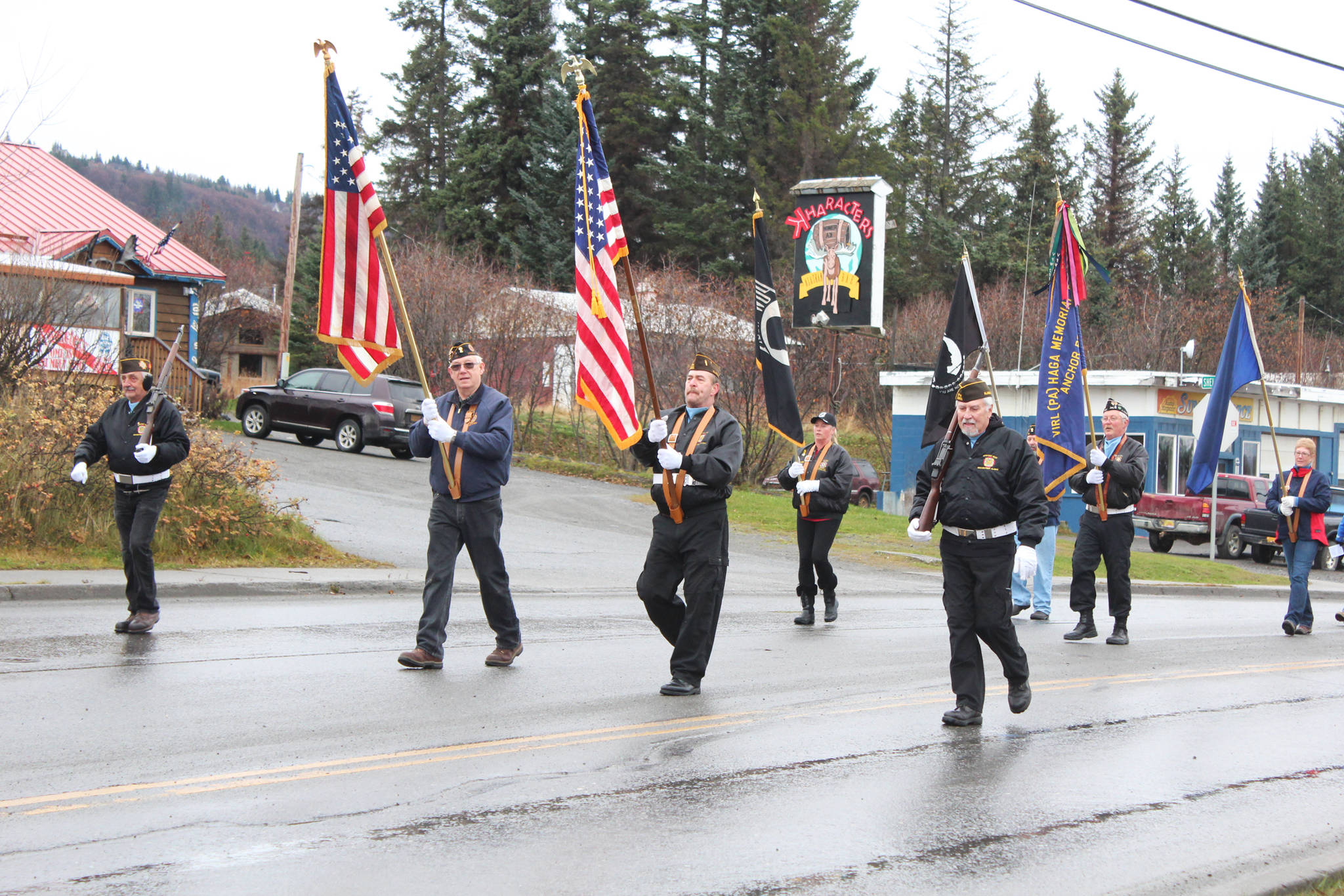Members of veterans organizations march down Pioneer Avenue during in a Veterans Day parade Sunday, Nov. 11, 2018 in Homer, Alaska. (Photo by Megan Pacer/Homer News)