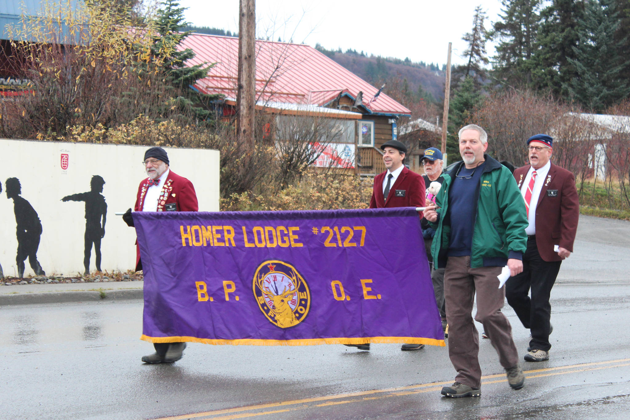 Members of the Homer Elks Club march in a Veterans Day parade Sunday, Nov. 11, 2018 in Homer, Alaska. (Photo by Megan Pacer/Homer News)