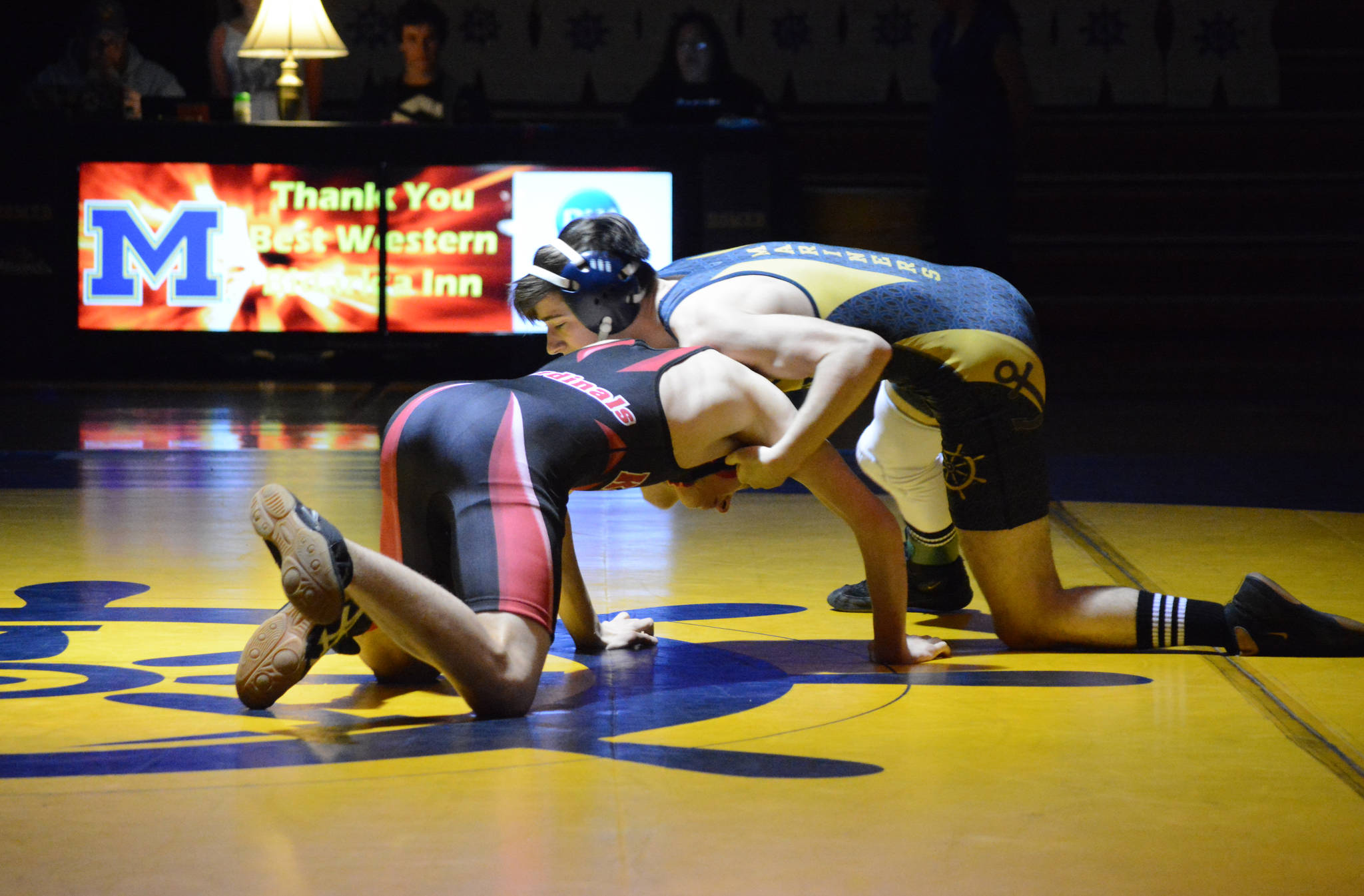 Homer High School Mariner Seth Inama, right, wrestles with Kenai High School Kardinal Daemon Duniphin, left, in a meet held Wednesday, Nov. 21, 2018, at the Homer High School Alice Witte Gym in Homer, Alaska. (Photo by Michael Armstrong/Homer News)