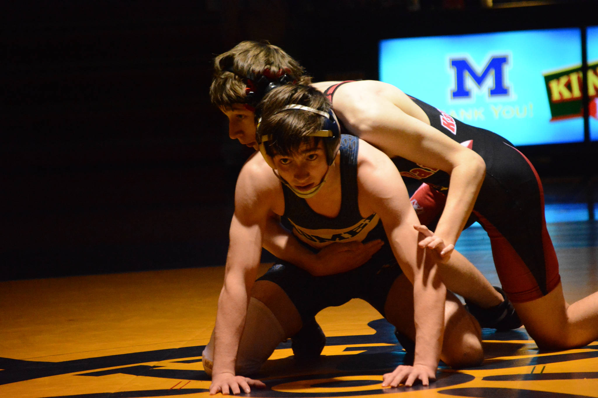 Homer High School Mariner Seth Inama, bottom wrestles with Kenai High School Kardinal Daemon Duniphin, top, in a meet held Wednesday, Nov. 21, 2018, at the Homer High School Alice Witte Gym in Homer, Alaska. (Photo by Michael Armstrong/Homer News)