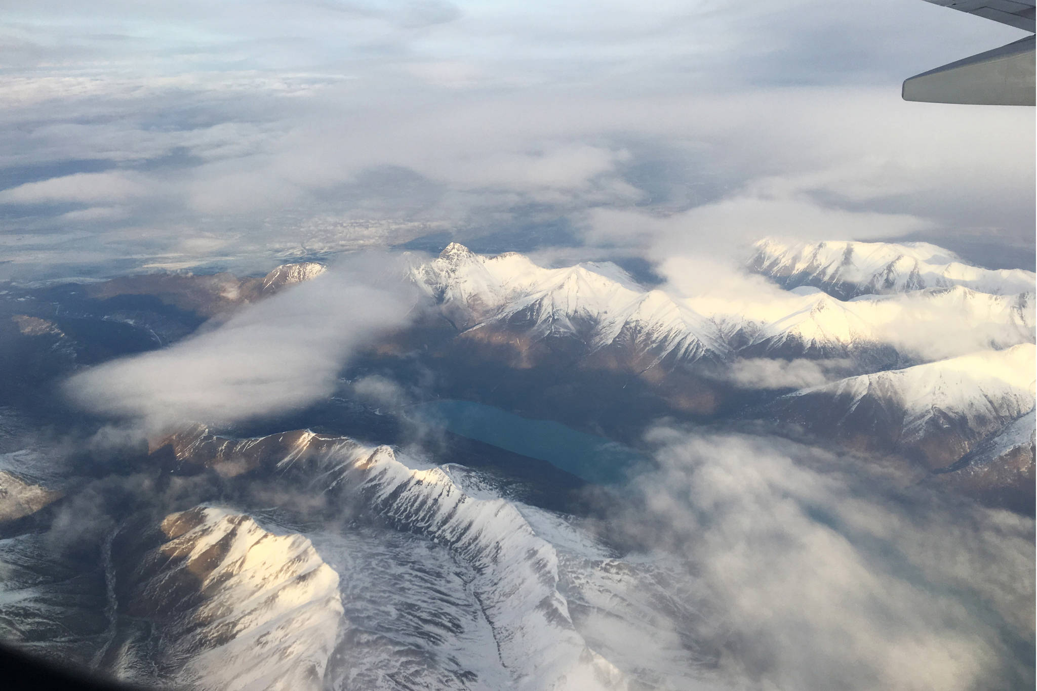 Snow caps a mountain range as seen on a flight from Anchorage to Seattle, Washington, on Wednesday, Nov. 22, 2018. (Photo by Megan Pacer/Homer News)