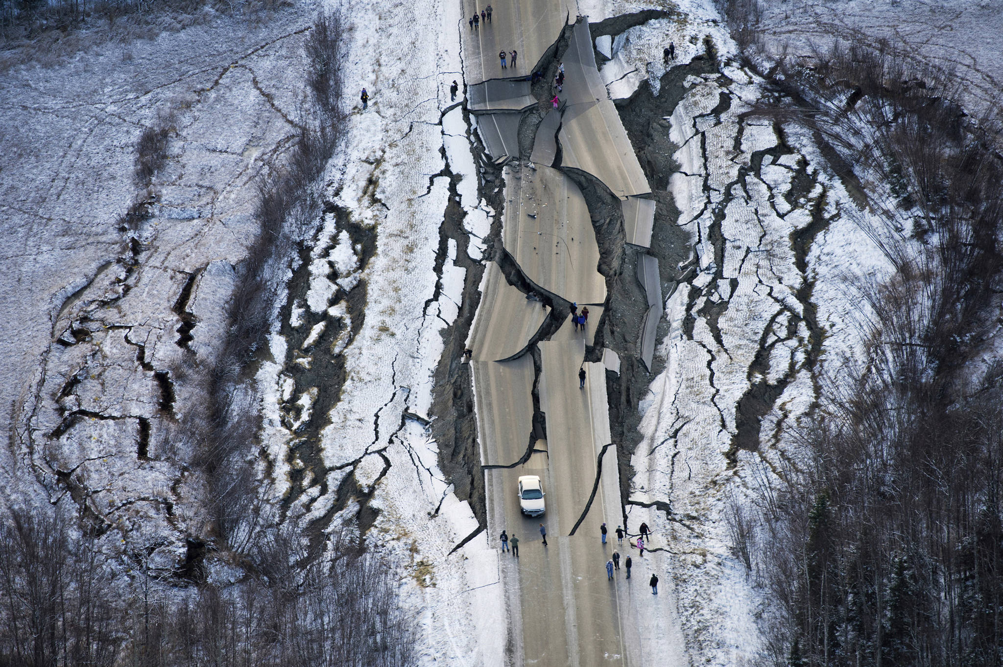 This Nov. 30, 2018 file aerial photo shows earthquake damage on Vine Road, south of Wasilla, Alaska. Alaska State Troopers are asking that people do not take selfies in front of the buckled roadway north of Anchorage, Alaska. (Marc Lester/Anchorage Daily News via AP)