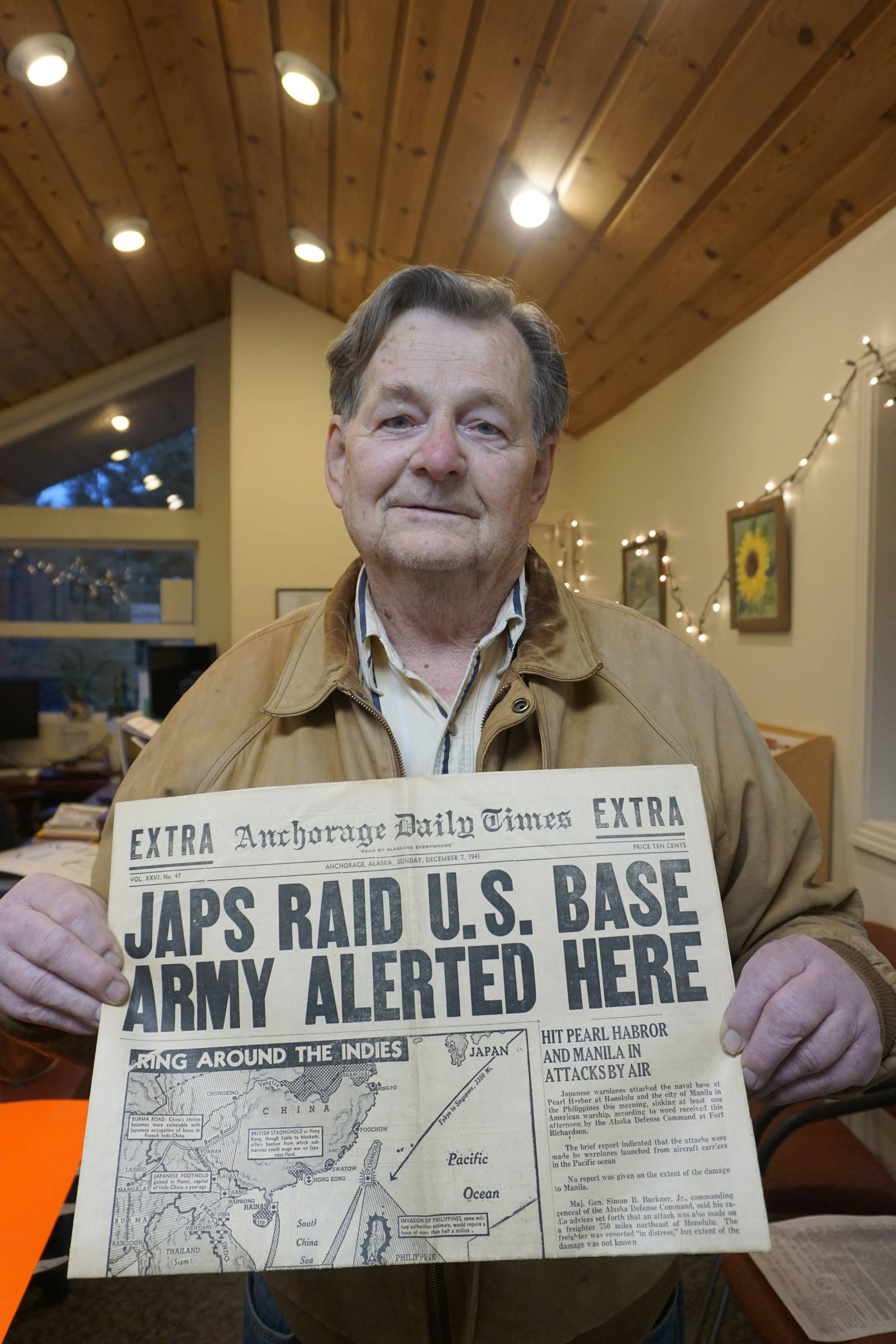 Jim Hadley holds a copy of the Dec. 7, 1941, Anchorage Daily Times reporting the bombing of Pearl Harbor. Hadley, 84, was 7 and living in Anchorage when the Japanese bombed Hawaii, causing the United States to declare war on Japan and enter World War II. Hadley visited the Homer News on Dec. 7, 2018, to share the newspaper with the staff. (Photo by Michael Armstrong/Homer News)