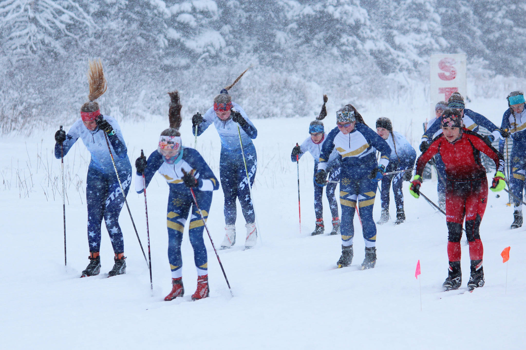 Skiers take off from the starting line of the girls’ race Friday, Dec. 14, 2018 during a Homer-hosted ski meet at the Ohlson Mountain Trails near Homer, Alaska. Varsity and JV skiers raced at the same time, with the JV members taking a shorter route. (Photo by Megan Pacer/Homer News)
