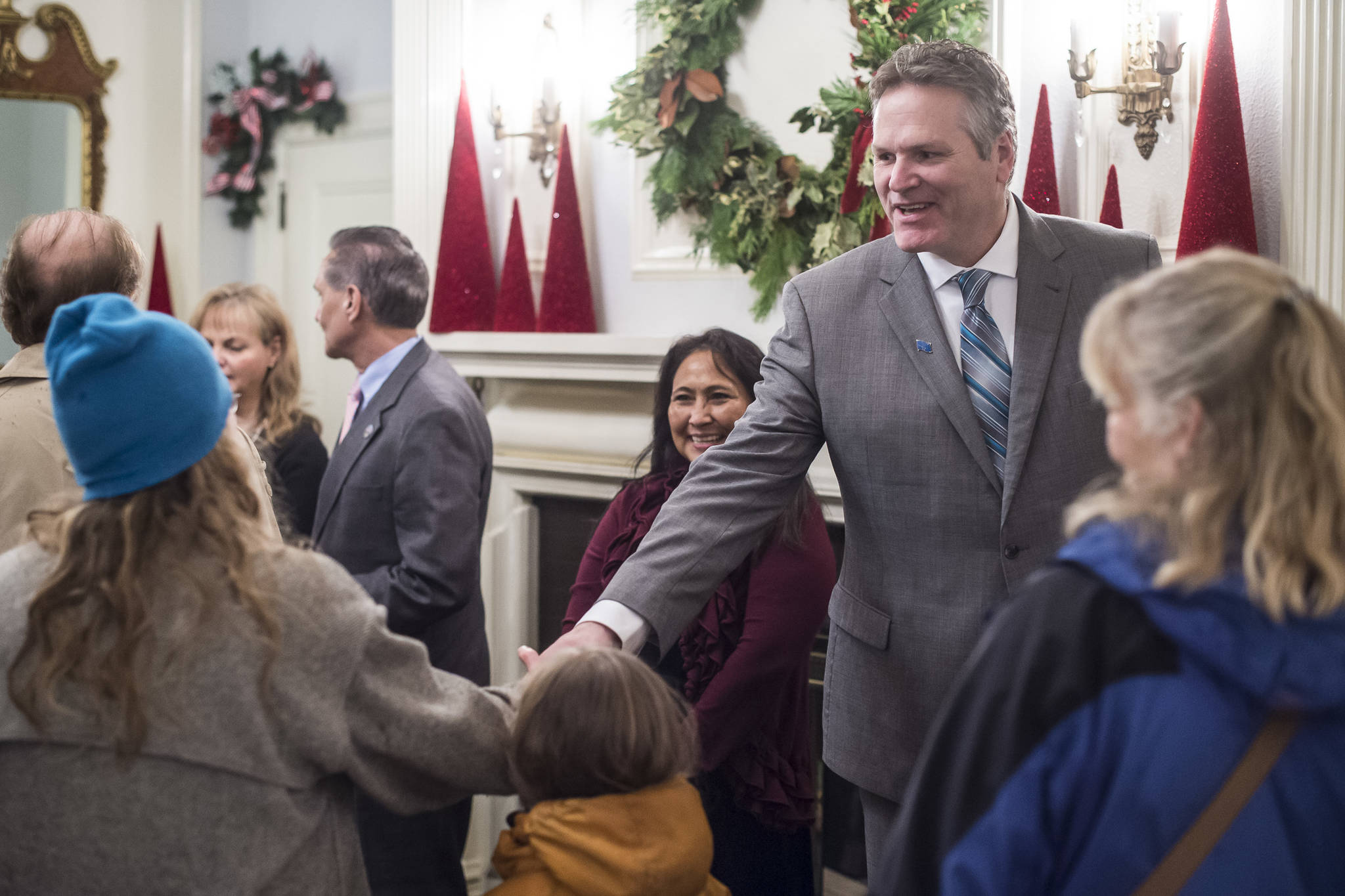 Gov. Mike Dunleavy and his wife, Rose, welcome Juneau residents at the Governor’s Open House on Tuesday. (Michael Penn | Juneau Empire)