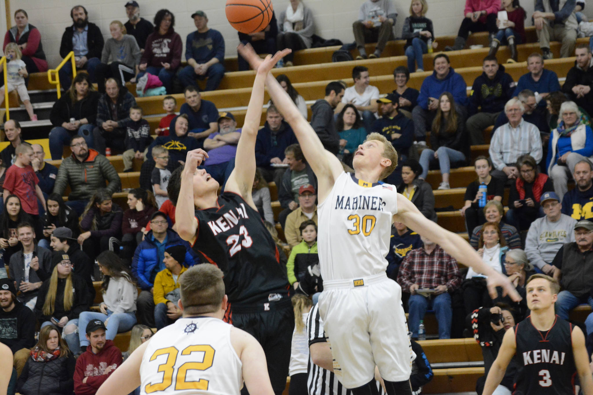 Mariner Japheth McGhee wins the tip-off during a basketball game between the Homer Mariners and the Kenai Kardinals on Friday, Dec. 21, 2018, at the Homer High School Alice Witte Gym in Homer, Alaska. (Photo by Michael Armstrong/Homer News)