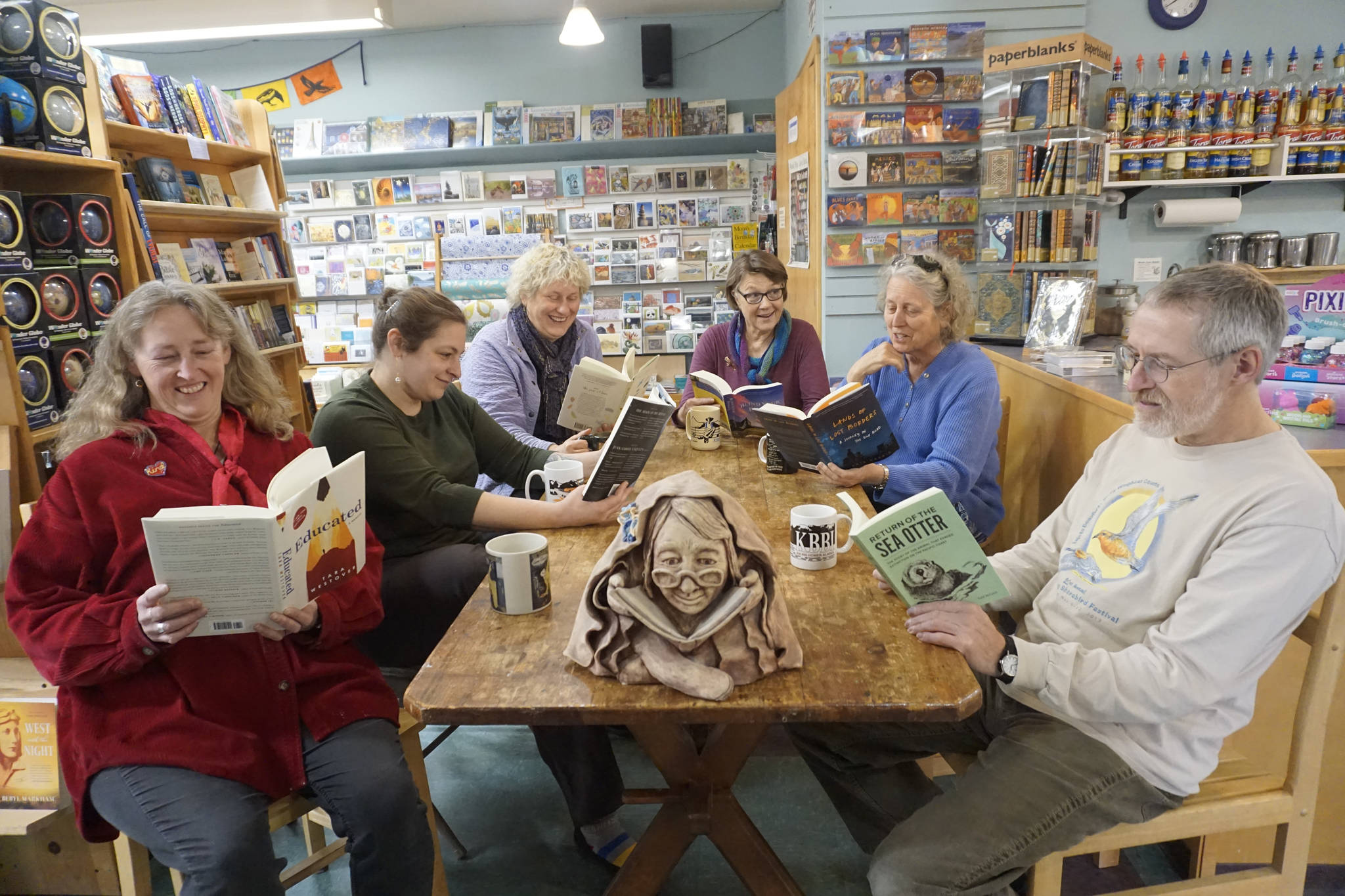 The staff and partners in the Homer Bookstore pose for a photo in the store’s cafe in Homer, Alaska, on Oct. 29, 2018. From left to right are Sue Post, partner; Jennifer Norton, staff; Jennifer Stroyeck, partner; Nancy Vait, staff; Sara Reinert, staff; and Lee Post, partner. (Homer News file photo)