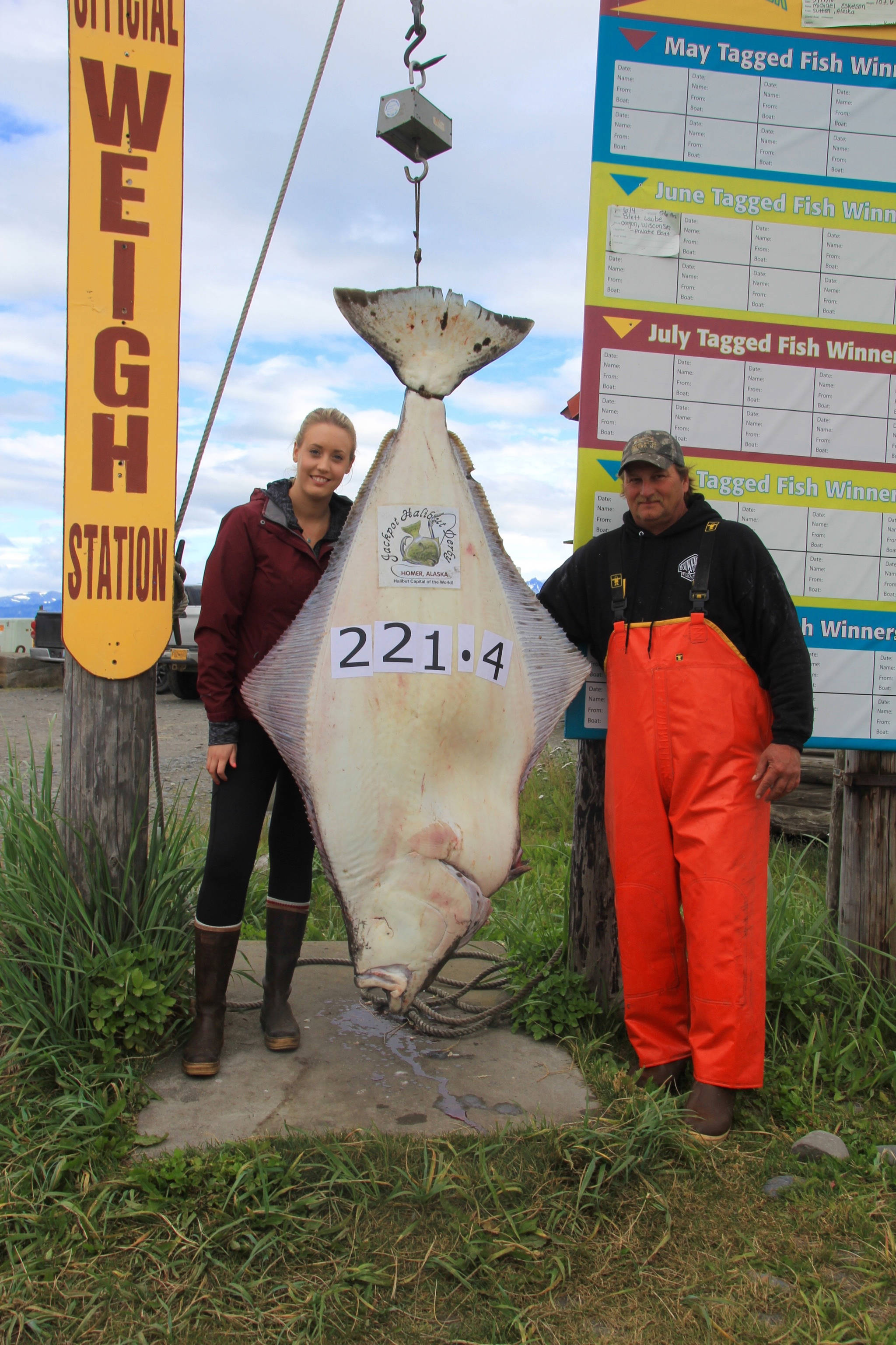 Ashley Camp, left, of Vancouver, British Columbia, Canada, poses with her 221.4-pound halibut caught on July 28, 2018 near Homer, Alaska. (Homer News file photo)