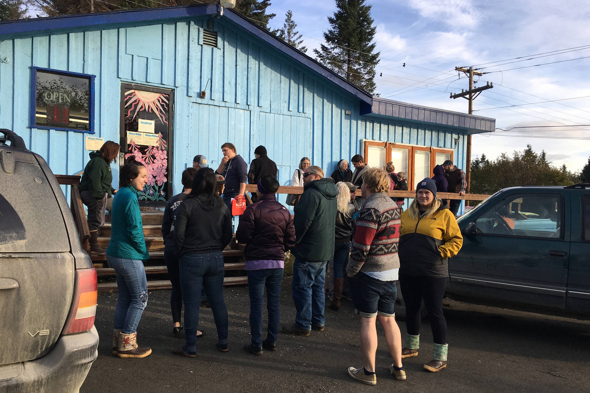 Movie lovers wait outside of Barb’s Video and DVD before it opens Saturday, Oct. 20, 2018 in Homer, Alaska. Saturday was the first day of a sale of the Barb’s merchandise. The business will officially close on Oct. 31. (Homer News file photo)