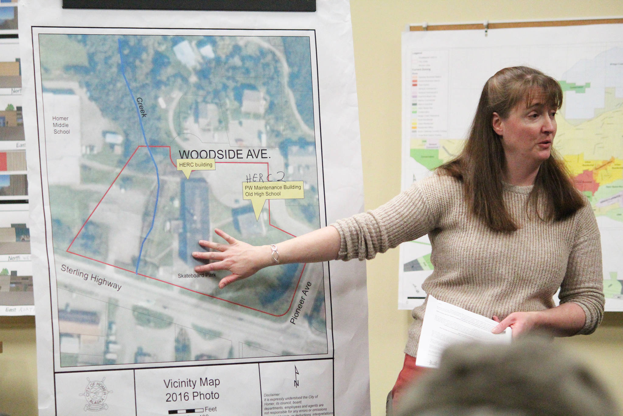 Deputy City Planner Julie Engebretsen explains elements of the Homer Education and Recreation Complex and plans for dealing with the devolving buildings during a Tuesday, Jan. 22, 2019 community meeting at City Hall in Homer, Alaska. (Photo by Megan Pacer/Homer News)