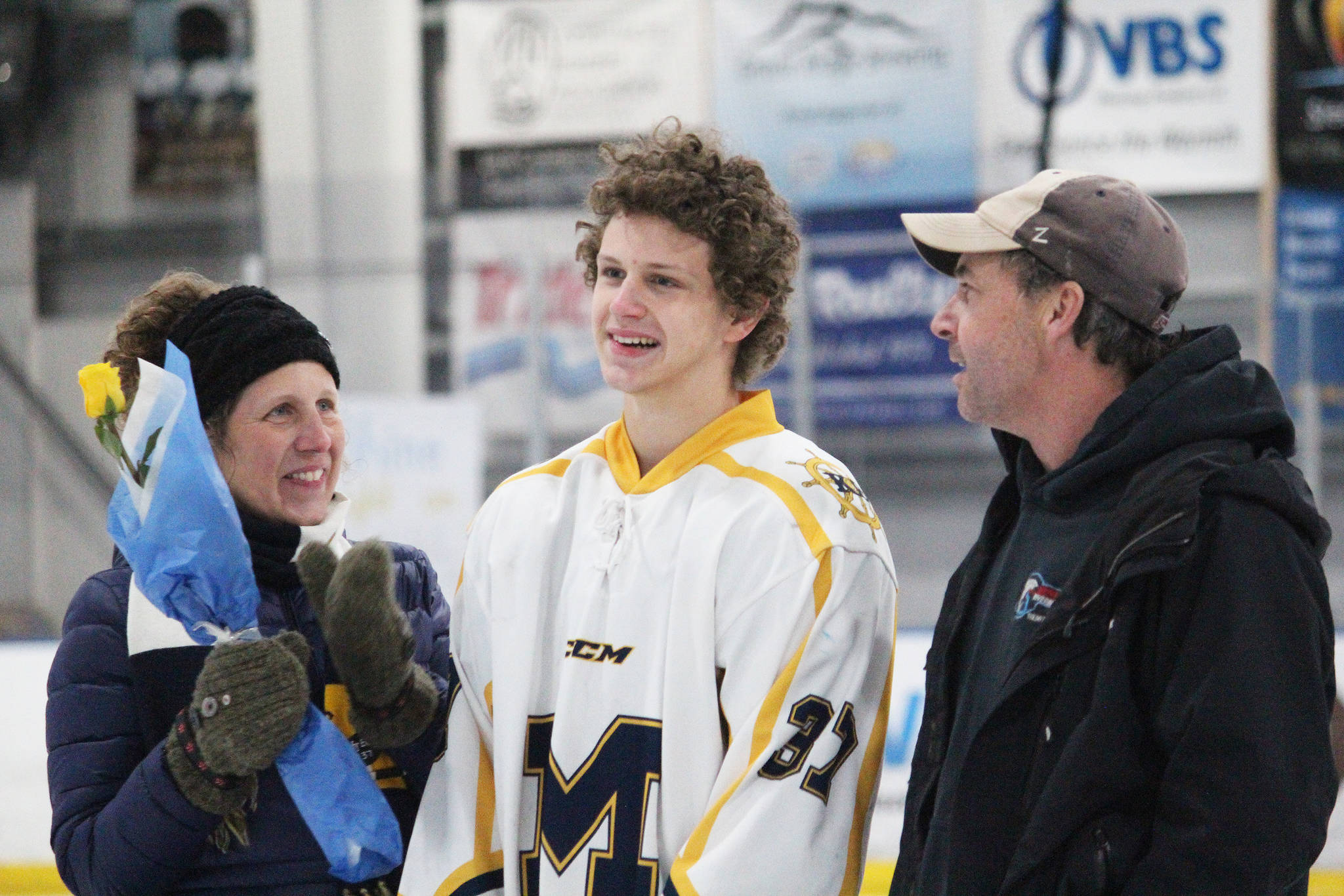 Homer senior Lee Lowe is honored with his parents on Senior Night for the Homer High School hockey team Thursday, Jan. 24, 2019 at Kevin Bell Arena in Homer, Alaska. The Mariners defeated Houston High School 10-1. (Photo by Megan Pacer/Homer News)
