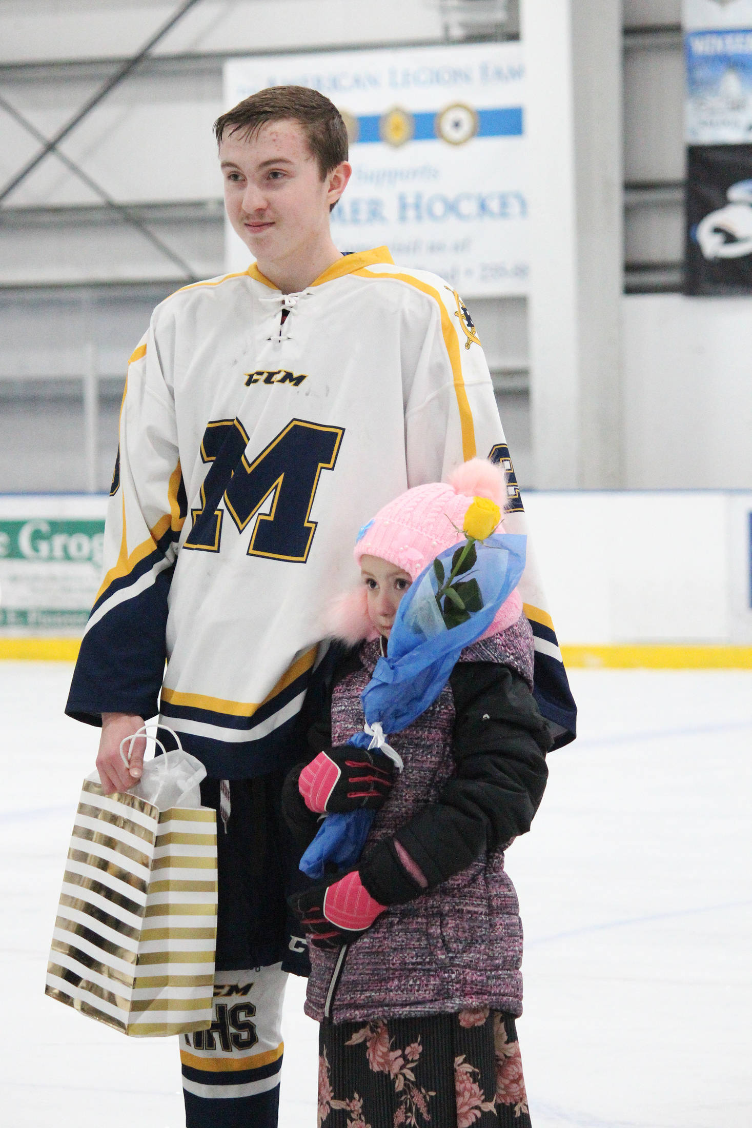 Homer senior Nikola Reutov is honored with his family on Senior Night for the Homer High School hockey team Thursday, Jan. 24, 2019 at Kevin Bell Arena in Homer, Alaska. The Mariners defeated Houston High School 10-1. (Photo by Megan Pacer/Homer News)