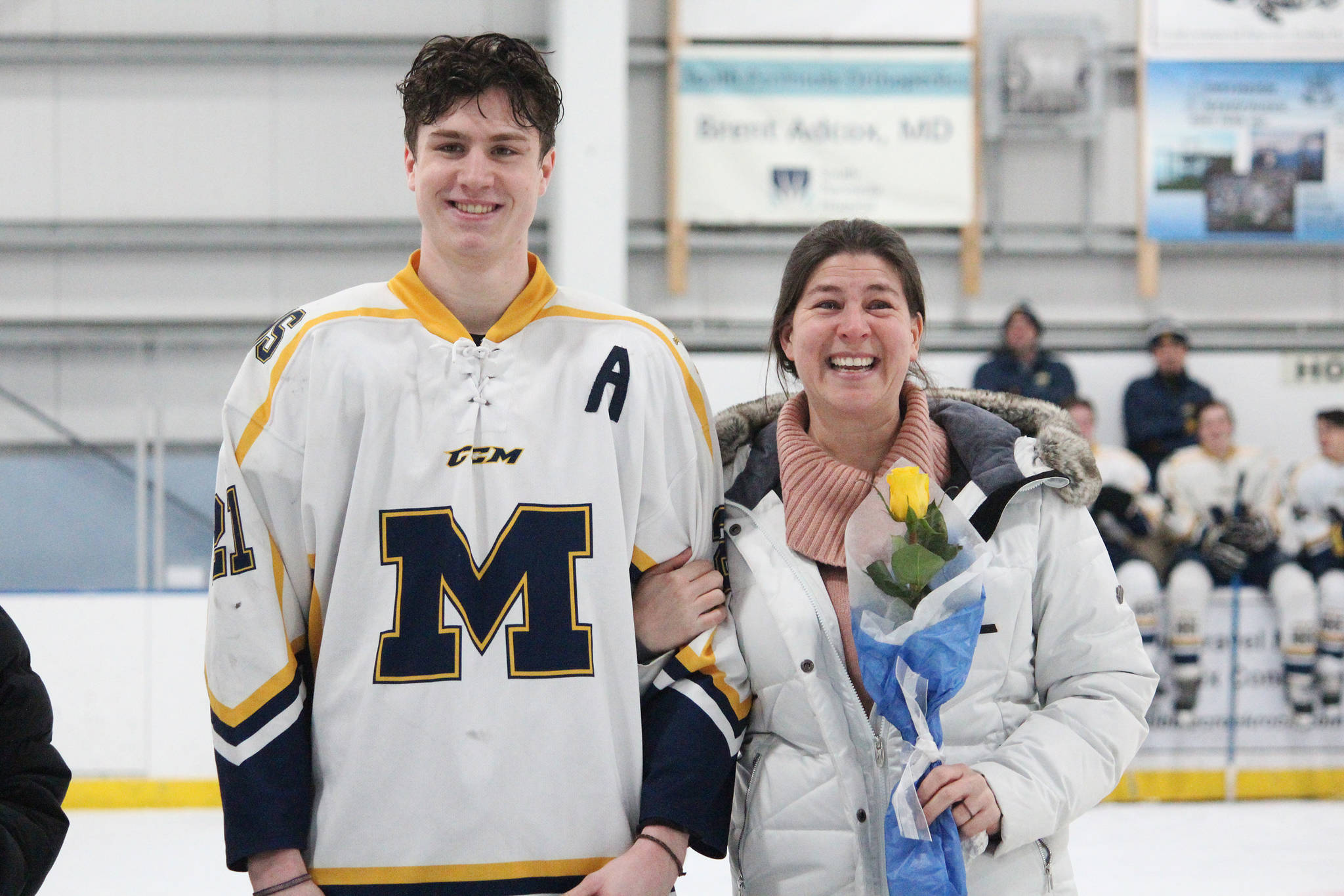 Homer senior Tucker Weston is honored with his mother on Senior Night for the Homer High School hockey team Thursday, Jan. 24, 2019 at Kevin Bell Ice Arena in Homer, Alaska. The Mariners defeated Houston High School 10-1. (Photo by Megan Pacer/Homer News)