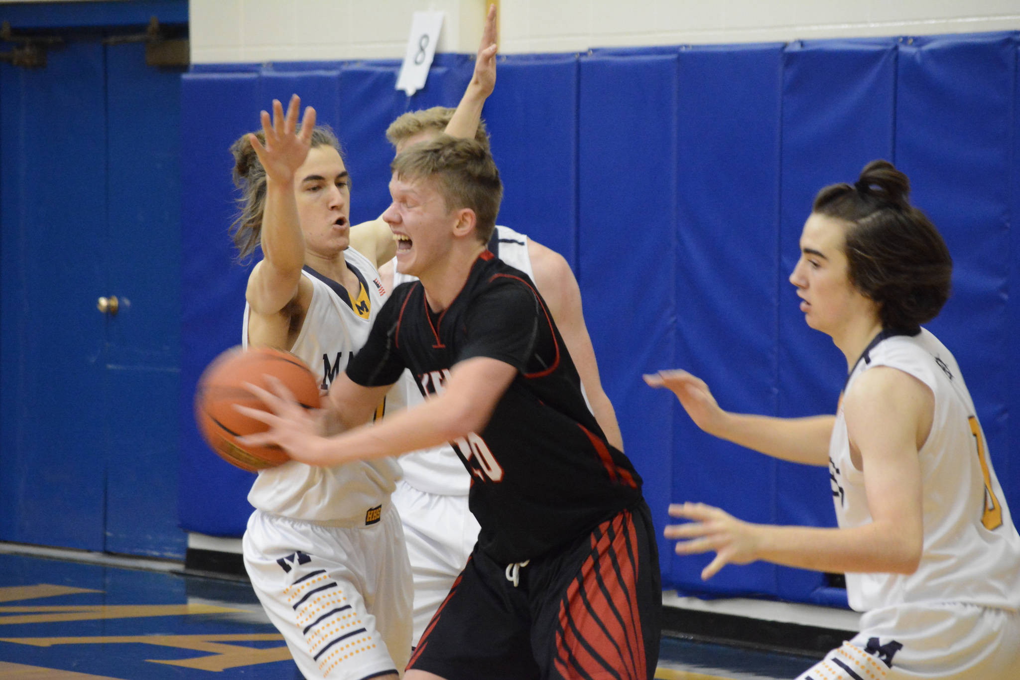 Kardinal Andrew Bezdecny tries to break away from the Mariner defense during a basketball game between the Kenai Kardinals and the Homer Mariners on Friday, Dec. 21, 2018, at the Homer High School Alice Witte Gym in Homer, Alaska. (Photo by Michael Armstrong/Homer News)