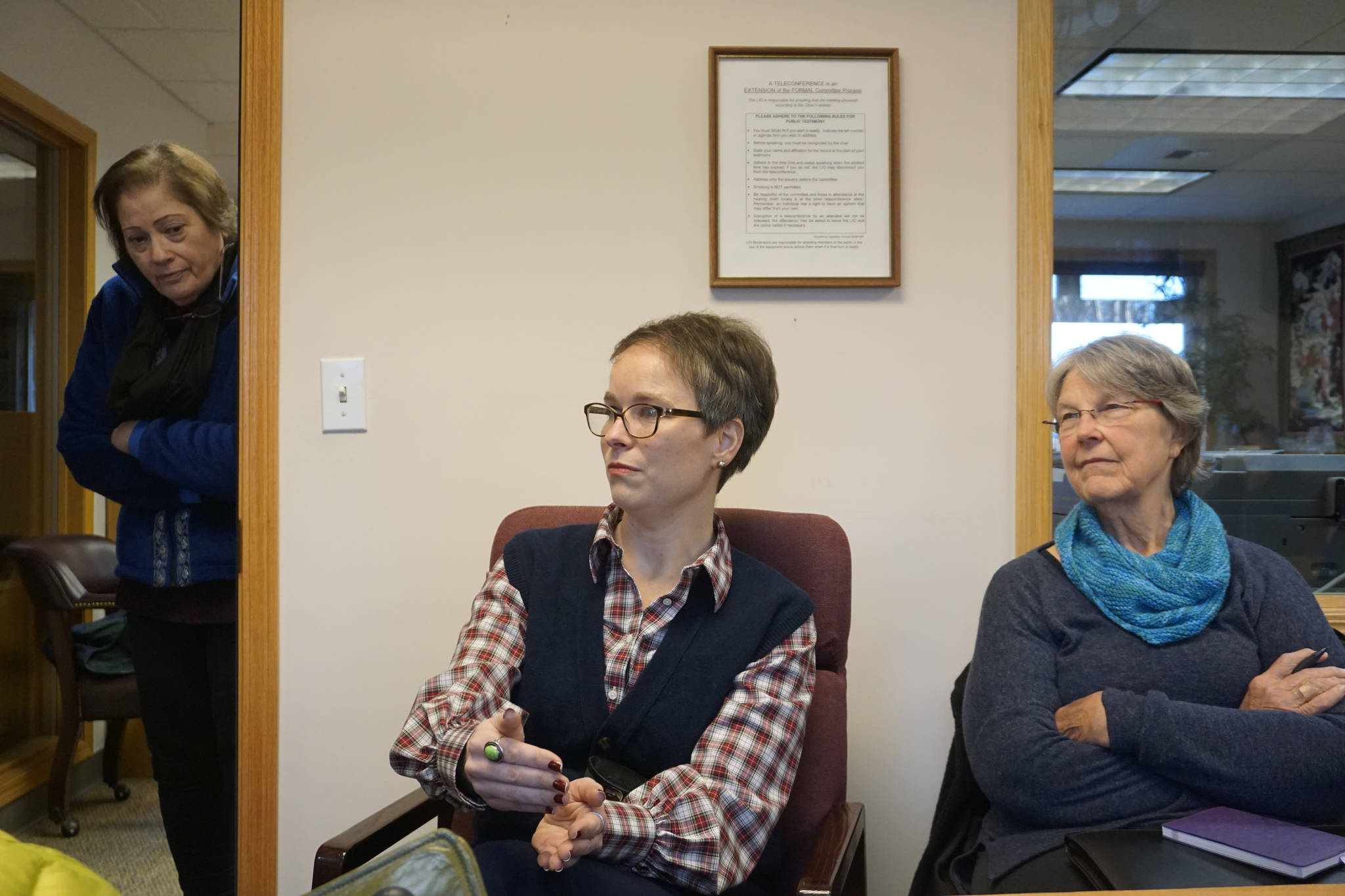 Rep.-elect Sarah Vance, R-Homer, speaks at a meeting on Thursday, Jan. 3, 2019, at the Homer Legislative Information Office in Homer, Alaska. Ardith Mumma, right, and Barn Angaiak, left, listen. As she headed to Juneau for the next session of the Alaska Legislature, Vance held meetings in Homer, Anchor Point, Ninilchik and Kasilof last weekend. (Photo by Michael Armstrong/Homer News)