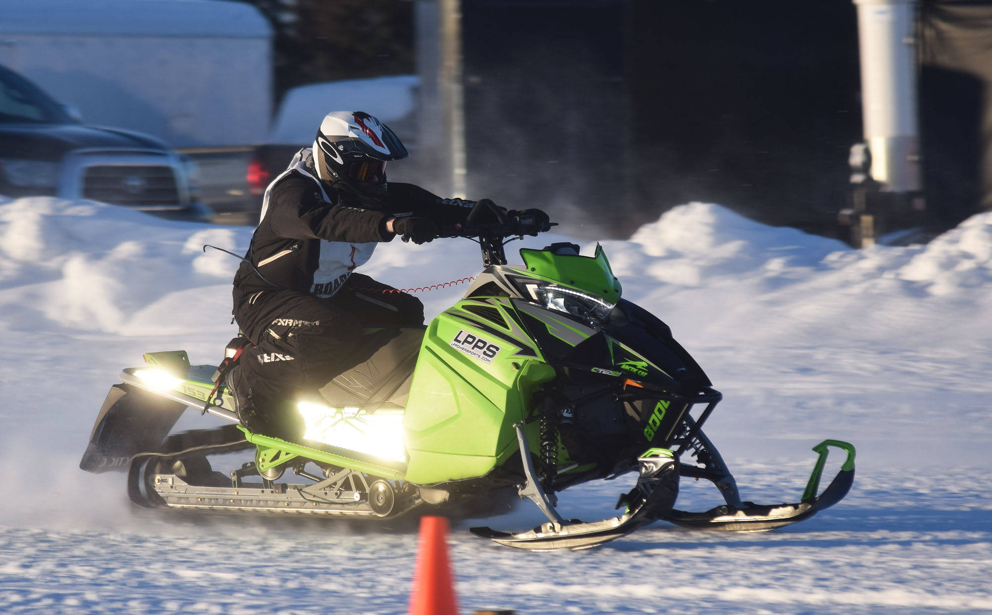 Richard Derkevorkian makes a pass in a heat race Saturday afternoon at the snowmachine drag races at Freddie’s Roadhouse near Ninilchik. (Photo by Joey Klecka/Peninsula Clarion)