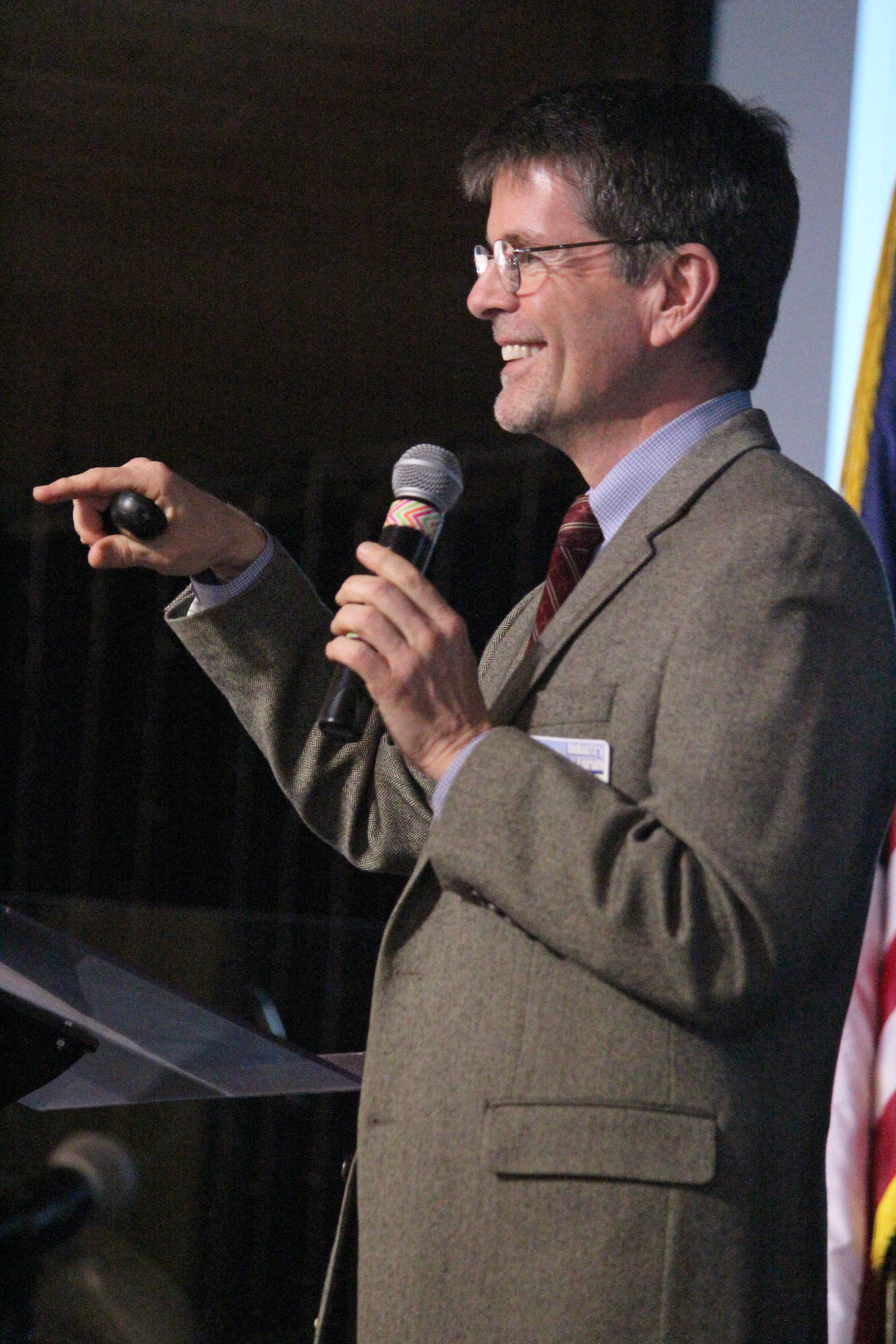 South Peninsula Hospital CEO Joe Woodin speaks to a crowd about the economics of medicine during the annual Industry Outlook Forum on Wednesday, Jan. 9, 2019 at Christian Community Church in Homer, Alaska. (Photo by Megan Pacer/Homer News)
