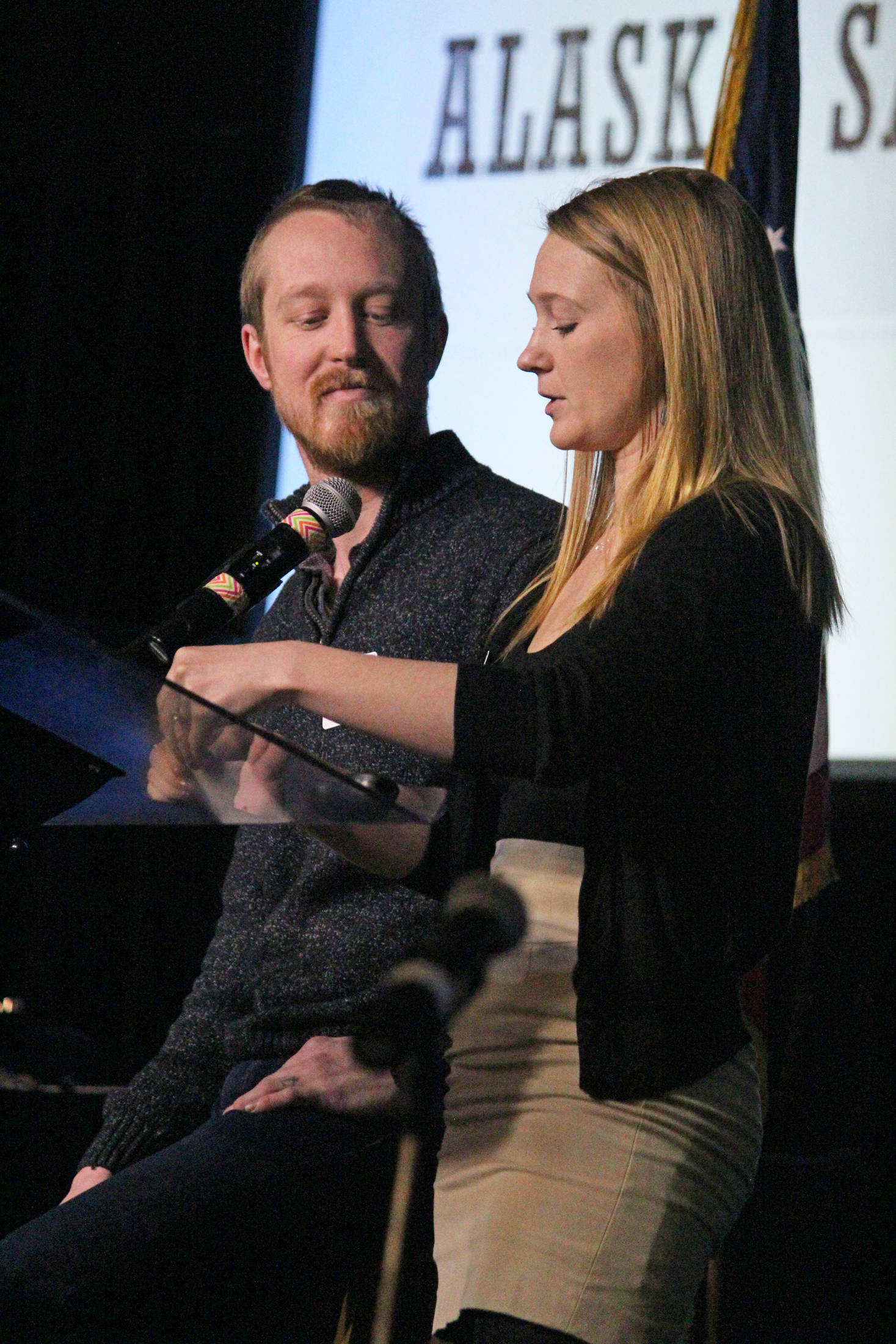 Casey (left) and Britni (right) Siekaniec, owners and operators of Alaska Salt Co., tell the story of their business during the annual Industry Outlook Forum on Wednesday, Jan. 9, 2019 in Homer, Alaska. (Photo by Megan Pacer/Homer News)