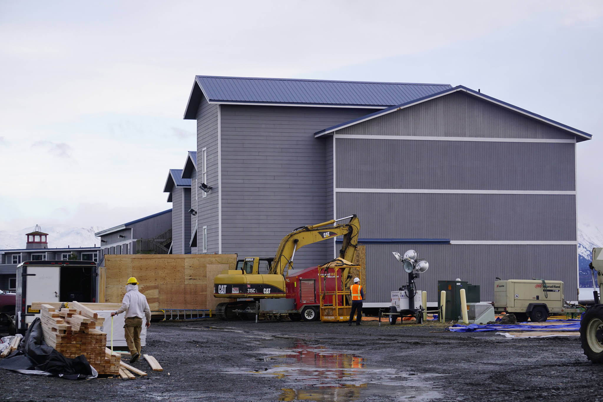 Carpenters with Steiner’s North Star Construction on Monday, Jan. 14, 2019 work on an addition at Land’s End Resort on the Homer Spit in Homer, Alaska. (Photo by Michael Armstrong/Homer News)