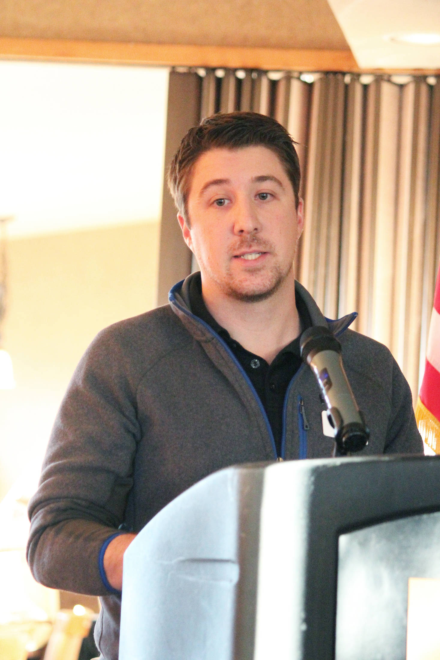 Patrick Mede, vice president of the Homer Chamber of Commerce Board of Directors, tells a crowd about the chamber’s finances over the last year during the annual chamber meeting Tuesday, Jan. 15, 2019 at the Best Western Bidarka Inn in Homer, Alaska. (Photo by Megan Pacer/Homer News)